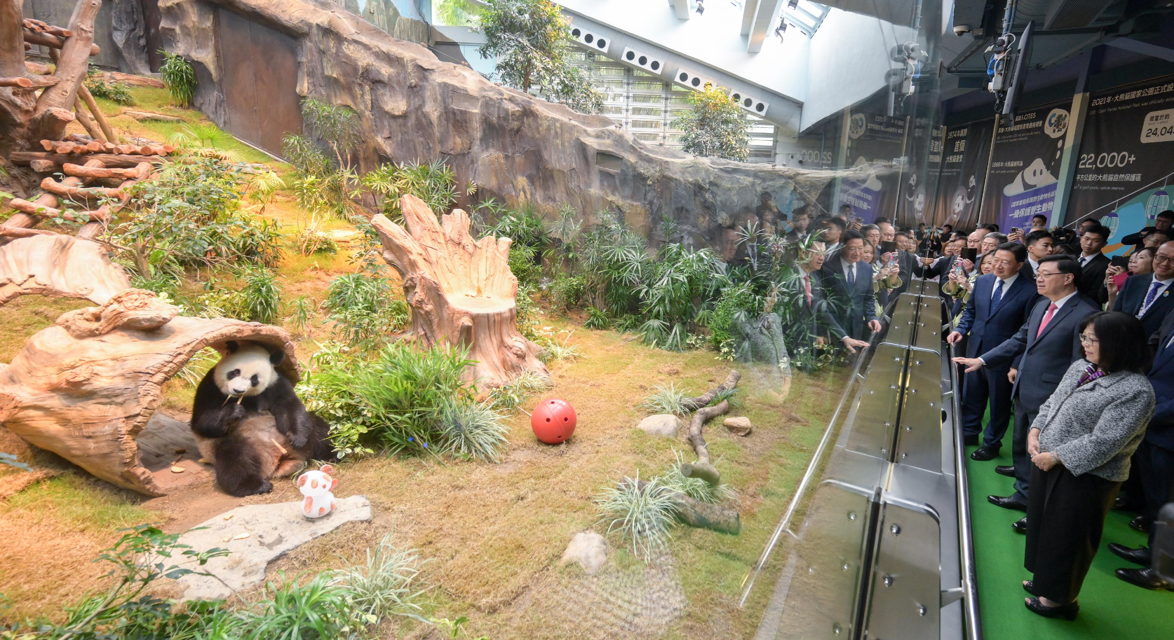 The Chief Executive, Mr John Lee, attended the Giant Panda Greeting Ceremony at the Ocean Park today (December 7). Photo shows Mr Lee (front row, second right) touring the Hong Kong Jockey Club Sichuan Treasures.