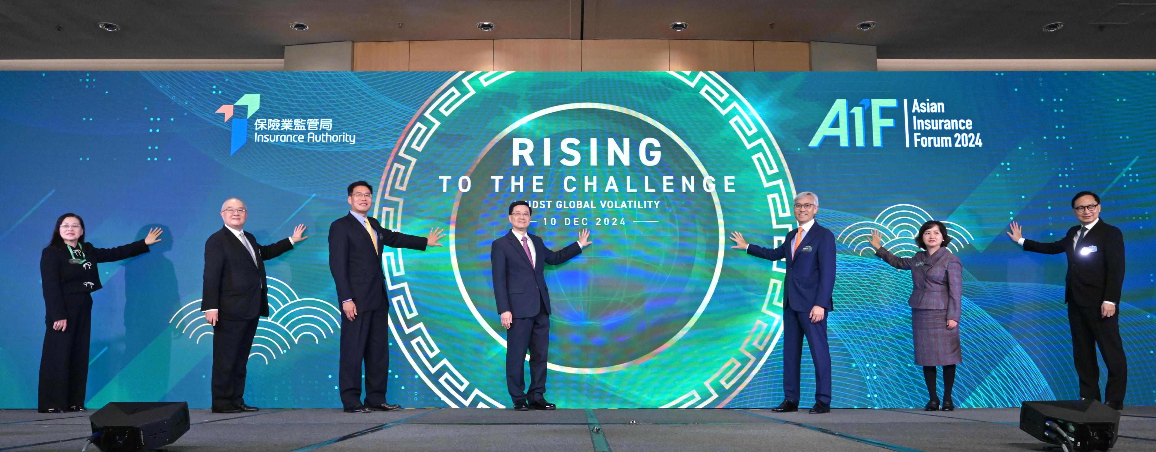 The Chief Executive, Mr John Lee, attended the Asian Insurance Forum 2024 today (December 10). Photo shows 
Mr Lee (centre); Deputy Director of the Liaison Office of the Central People's Government in the Hong Kong Special Administrative Region Mr Qi Bin (third left); the Chairman of the Insurance Authority, Mr Stephen Yiu (third right); the Chief Executive Officer of the Insurance Authority, Mr Clement Cheung (first right); and other guests officiating at the forum.