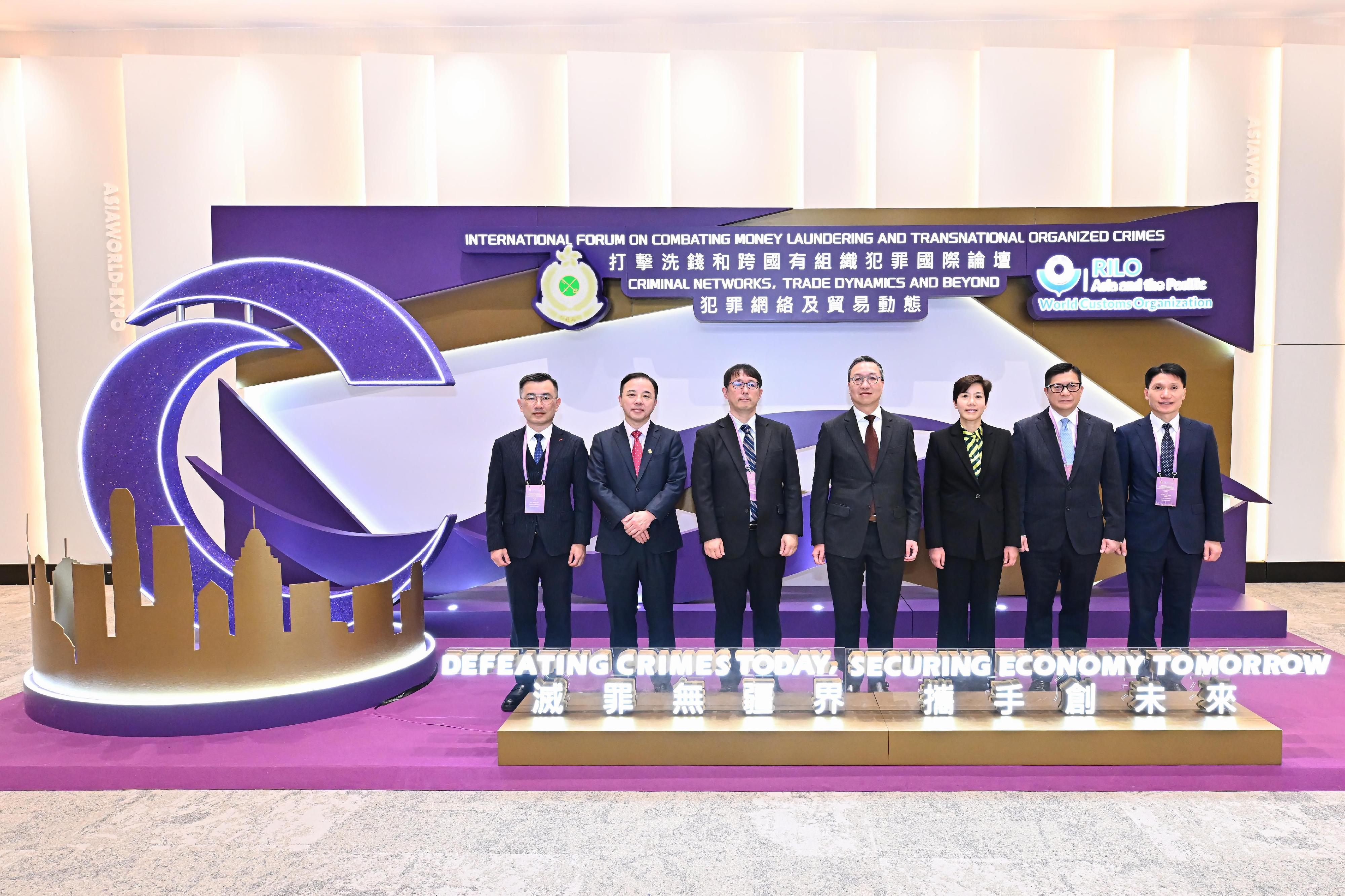 Hong Kong Customs and the Regional Intelligence Liaison Office for Asia and the Pacific today (December 10) hosted a three-day International Forum on Combating Money Laundering and Transnational Organized Crimes. Photo shows the Commissioner of Customs and Excise, Ms Louise Ho (third right); the Secretary for Justice, Mr Paul Lam, SC (centre); the Secretary for Security, Mr Tang Ping-keung (second right); the Head of the Regional Intelligence Liaison Office for Asia and the Pacific, Mr Toshihiko Osawa (third left); ​The Deputy Commissioner (Control and Enforcement) of Customs and Excise, Mr Mark Woo (first right); the President and Vice-Chancellor of the University of Hong Kong, Professor Xiang Zhang (second left); and the Assistant Commissioner (Intelligence and Investigation), Mr Barry Lai (first left).