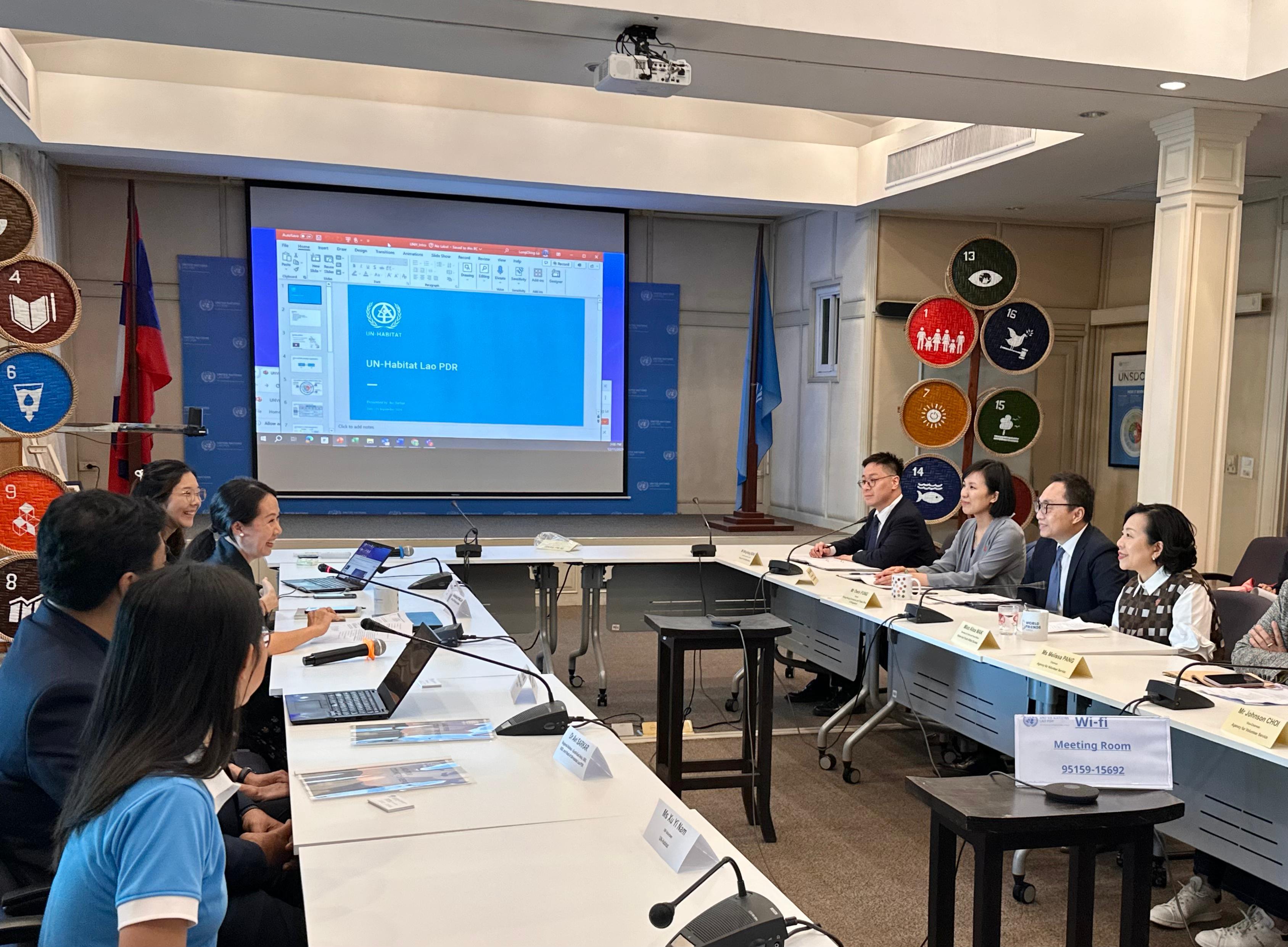 The Secretary for Home and Youth Affairs, Miss Alice Mak, continued her visit to Laos today (December 11). Photo shows Miss Mak (first right) visiting the United Nations Development Programme and the United Nations Human Settlements Programme in Laos to meet with agencies' representatives and volunteer interns who participated in the United Nations Volunteers - Hong Kong Universities Volunteer Internship Programme.
