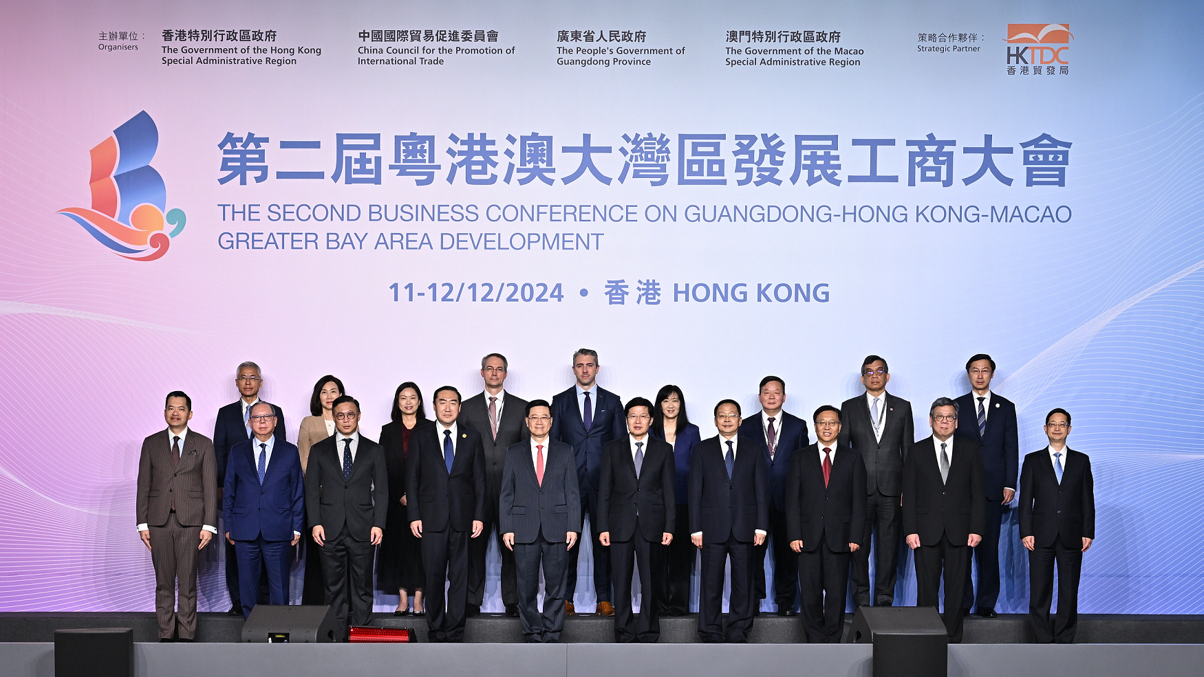 The Chief Executive, Mr John Lee, attended the opening ceremony of Second Business Conference on Guangdong-Hong Kong-Macao Greater Bay Area Development today (December 11). Photo shows (from first row, fourth left) Vice Chairman of the China Council for the Promotion of International Trade Mr Zhang Shaogang; Mr Lee; Vice-Chairman of the National Committee of the Chinese People's Political Consultative Conference Mr Gao Yunlong; Deputy Director of the Liaison Office of the Central People's Government in the Hong Kong Special Administrative Region (HKSAR) Mr Yin Zonghua; the Commissioner of the Ministry of Foreign Affairs in the HKSAR, Mr Cui Jianchun, and other guests at the ceremony.