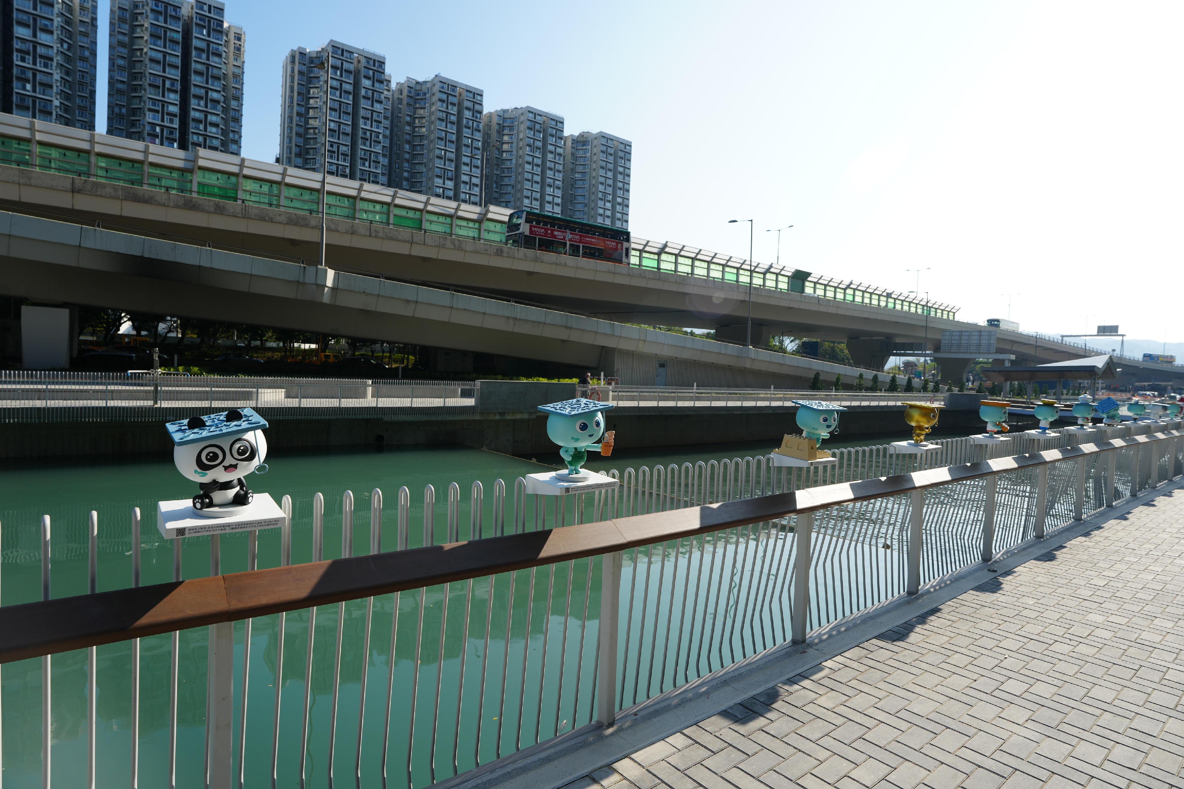 Under the Revitalization of Tsui Ping River project by the Drainage Services Department (DSD), the Tsui Ping River facilities along the King Yip Street section were opened for public use today (December 12). Photo shows art installations of the DSD KOL (key opinion leader) named Drainy with various themes placed along the riverbank of the King Yip Street section of the Tsui Ping River for public viewing and photo taking.