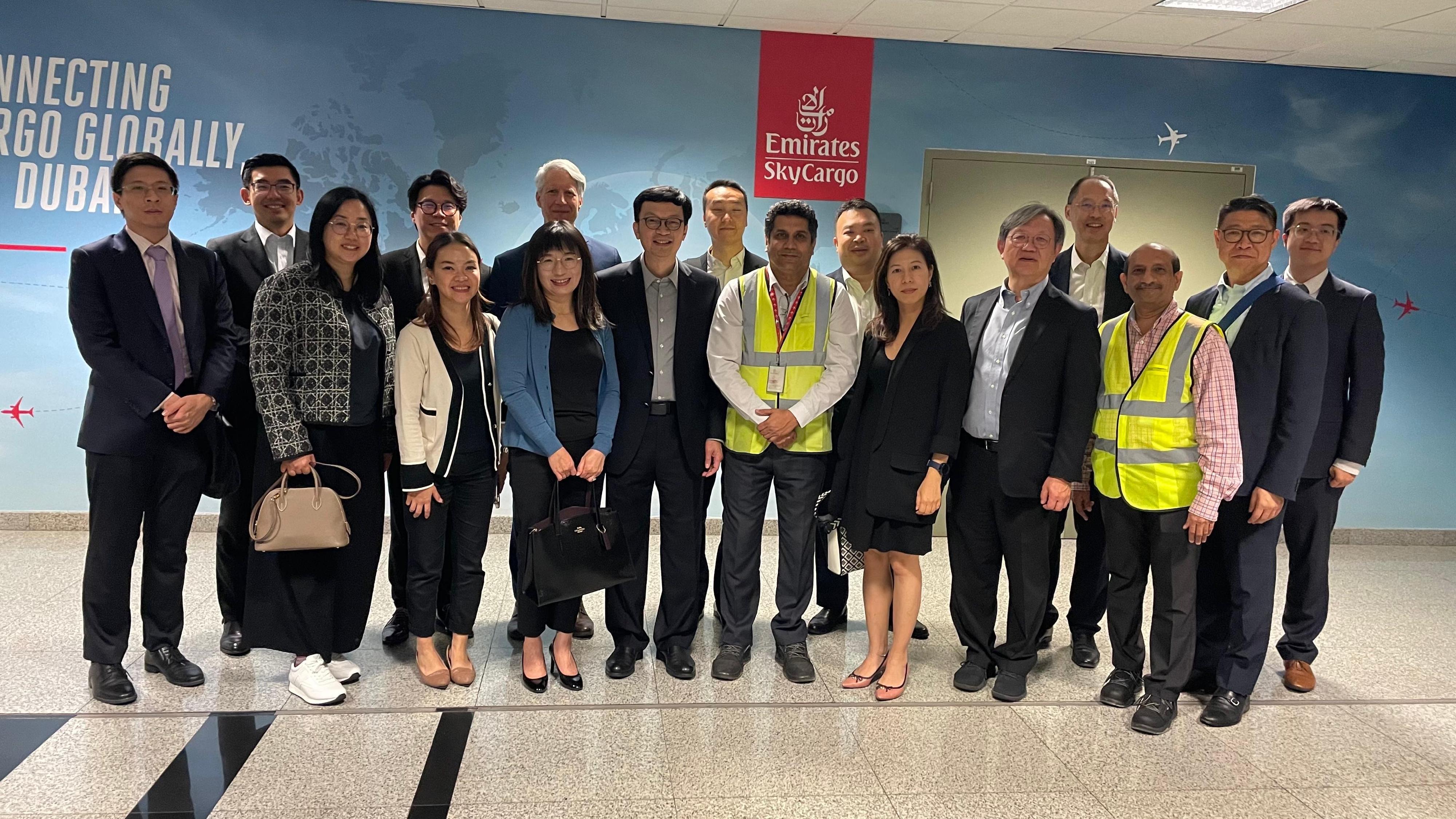 The Under Secretary for Transport and Logistics, Mr Liu Chun-san, led a delegation of over 10 members from the Hong Kong Maritime and Port Board and the Hong Kong Logistics Development Council, and representatives from the Marine Department and Invest Hong Kong, for a five-day visit to Dubai and Abu Dhabi, United Arab Emirates, and Bahrain. Mr Liu (front row, fifth left), Deputy Secretary for Transport and Logistics Miss Amy Chan (front row, fourth left) and members of the Hong Kong Logistics Development Council, toured the Emirates SkyCargo at the Dubai International Airport on December 13 (Dubai time), to inspect the air cargo facilities in the terminal and understand the development of the city's air cargo industry.
