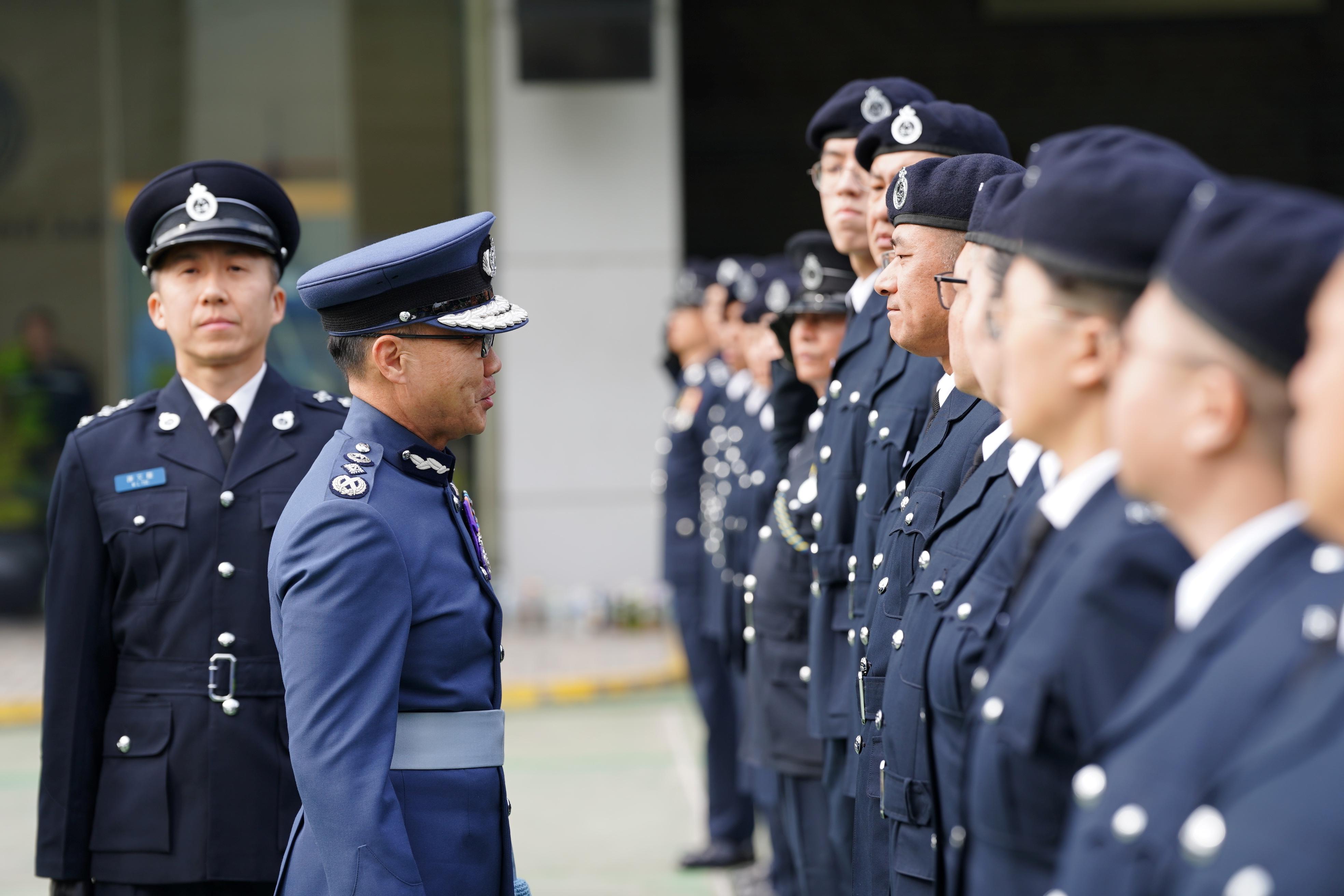 The Civil Aid Service held the 89th Recruits Passing-out Parade at its headquarters today (December 15). Photo shows the Controller of the Government Flying Service, Captain West Wu (second left), inspecting the parade. 
