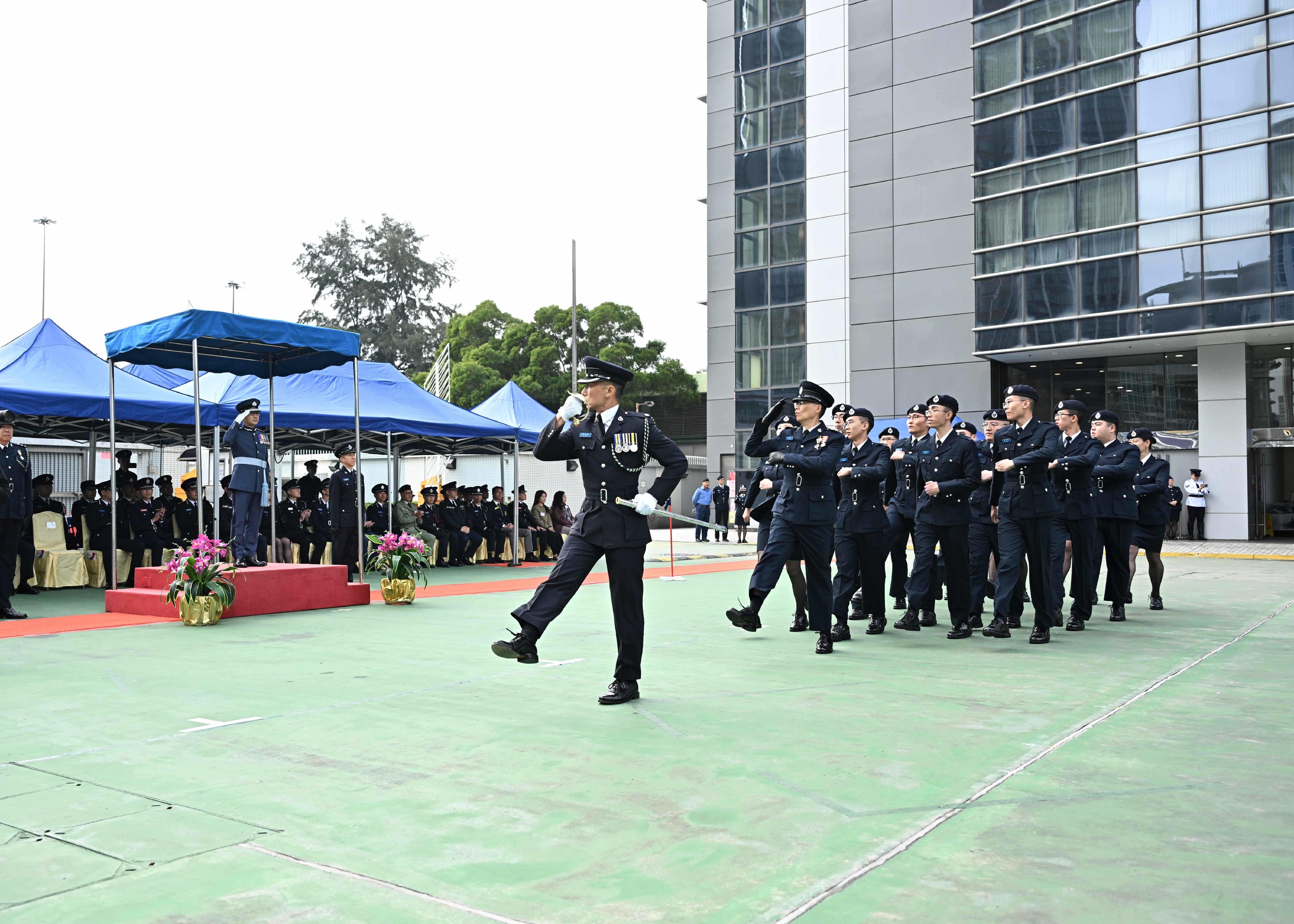 The Civil Aid Service held the 89th Recruits Passing-out Parade at its headquarters today (December 15). Photo shows the graduates marching past the review stand.