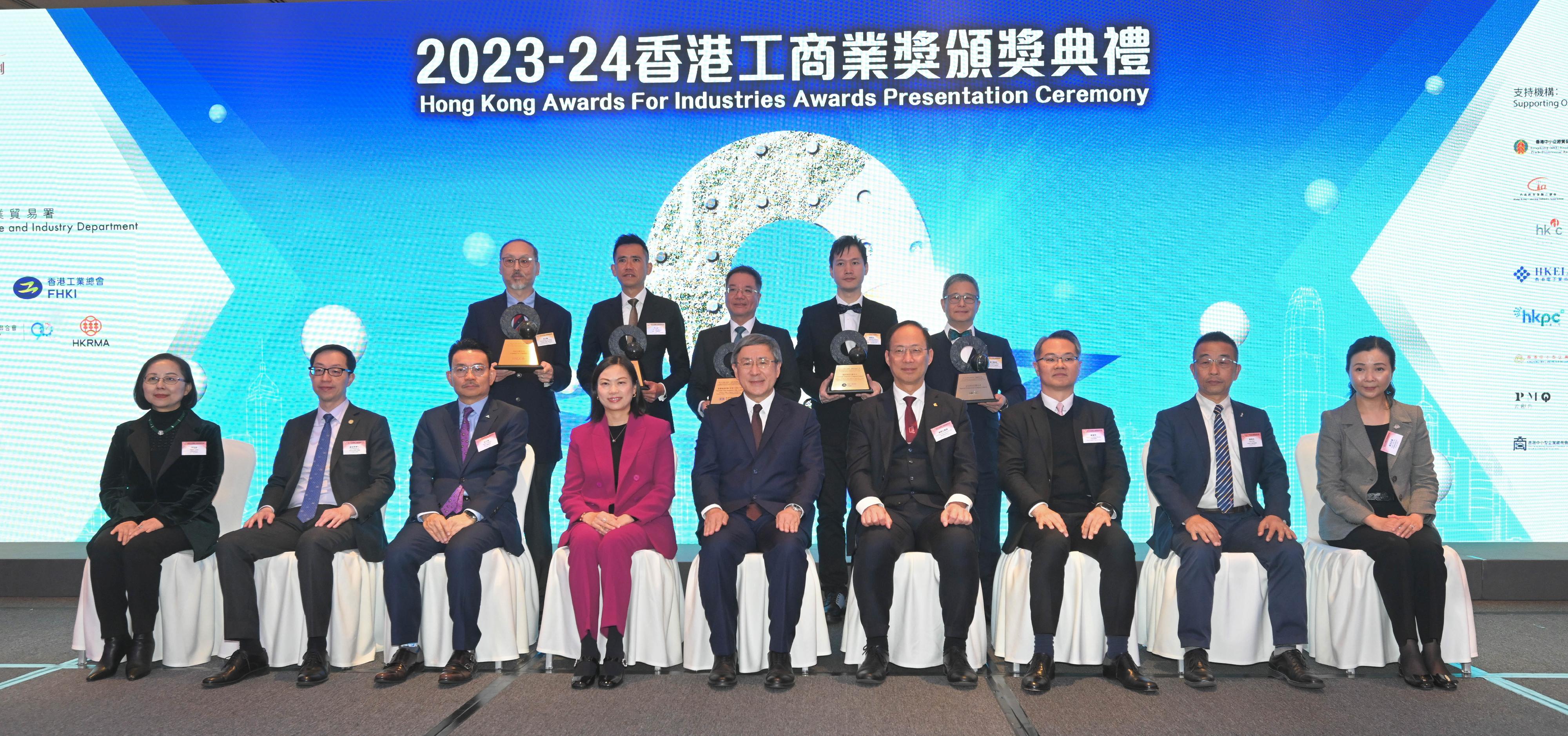 To commend 79 local companies for their outstanding achievements, the 2023-24 Hong Kong Awards for Industries (HKAI) Presentation Ceremony was held today (December 16) at the Hong Kong Convention and Exhibition Centre. Photo shows (front row, from left) the Chairman of the Hong Kong General Chamber of Commerce, Ms Agnes Chan; the President of the Chinese Manufacturers' Association of Hong Kong, Dr Wingco Lo; the Chairman of the Federation of Hong Kong Industries, Mr Steve Chuang; the Permanent Secretary for Commerce and Economic Development, Ms Maggie Wong; the Deputy Chief Secretary for Administration, Mr Cheuk Wing-hing; the Chairman of the final judging panels of the HKAI, Professor Alexander Wai Ping-kong; the Director-General of Trade and Industry, Mr Aaron Liu; the President of the Hong Kong Young Industrialists Council, Mr Felix Choi; and the Chairman of the Hong Kong Retail Management Association, Mrs Annie Tse, with the awardees.