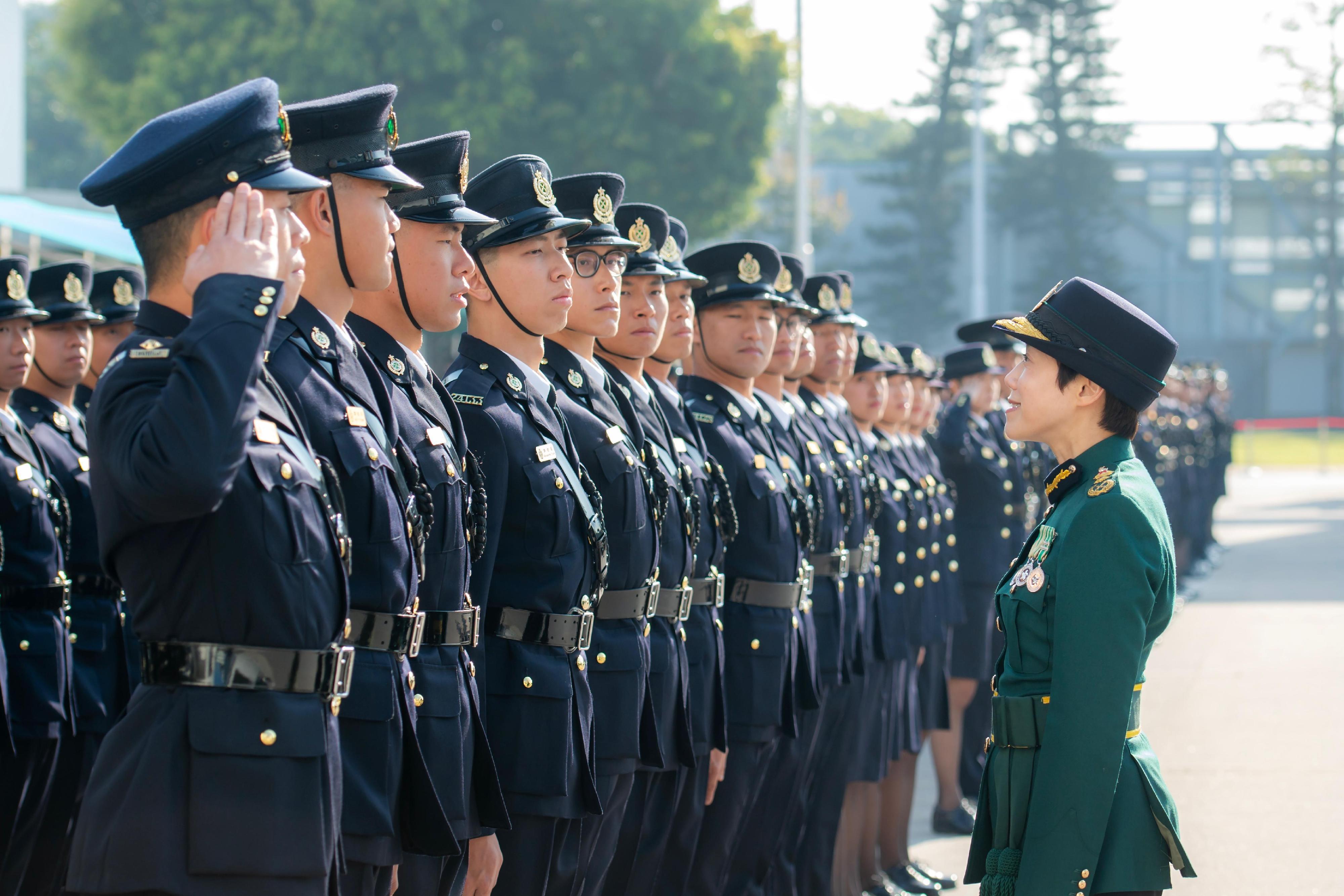 The Commissioner of Customs and Excise, Ms Louise Ho, inspects passing-out officers at the Hong Kong Customs Passing-out Parade today (December 17).