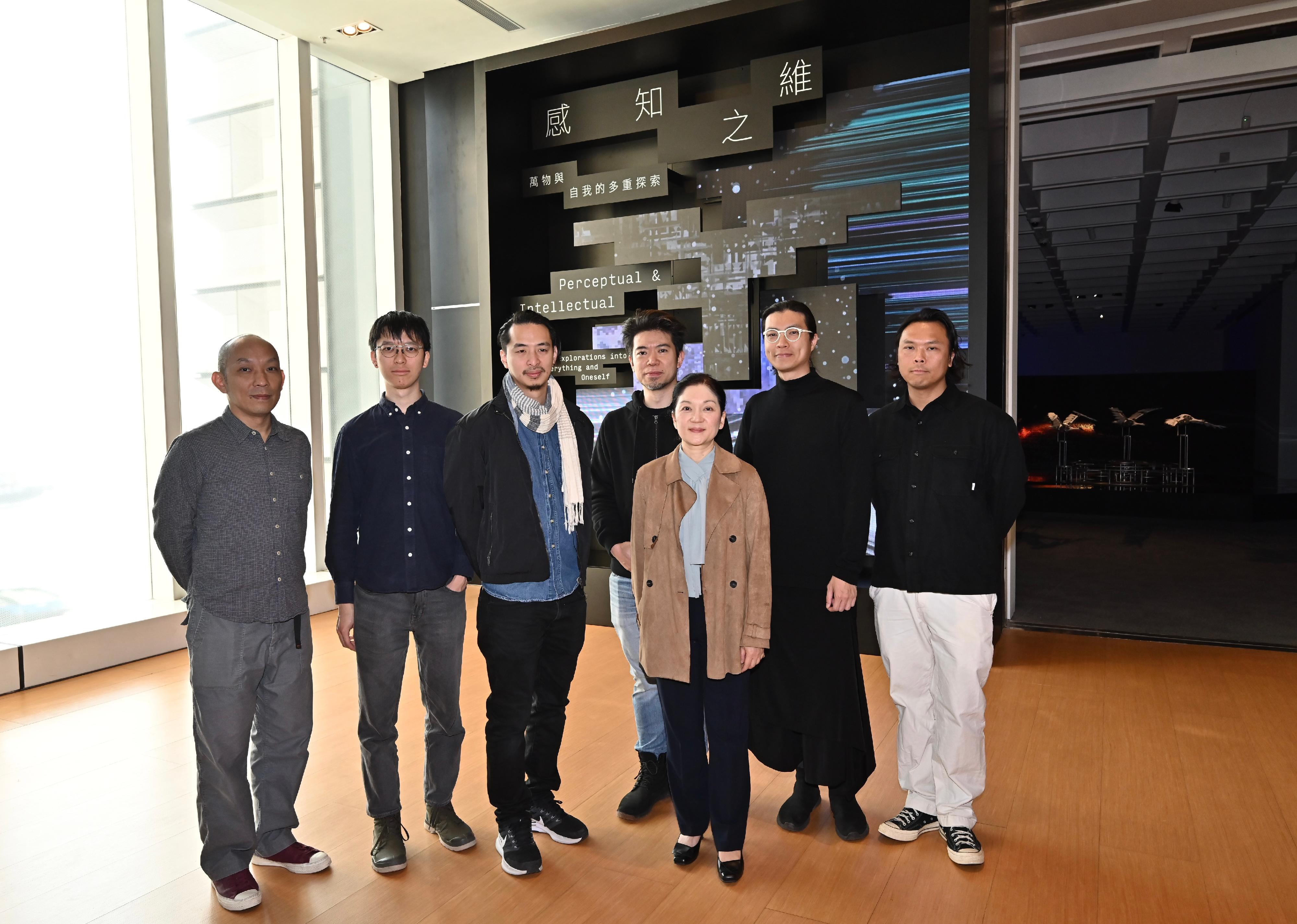 The Hong Kong Museum of Art (HKMoA) will hold the "Perceptual and Intellectual - Explorations into Everything and Oneself" exhibition starting from December 20. The exhibition will feature 10 sets of installations and interactive new media creations by Hong Kong artists. Photo shows (from left) the Art Tech partner of the exhibition, Ng Tsz-kwan; participating artists Tung Wing-hong, Kenny Wong and Joseph Chan; the Curator (Modern and Hong Kong Art) of the HKMoA, Ms Leona Yu; and participating artists Chris Cheung and Samuel Yip.