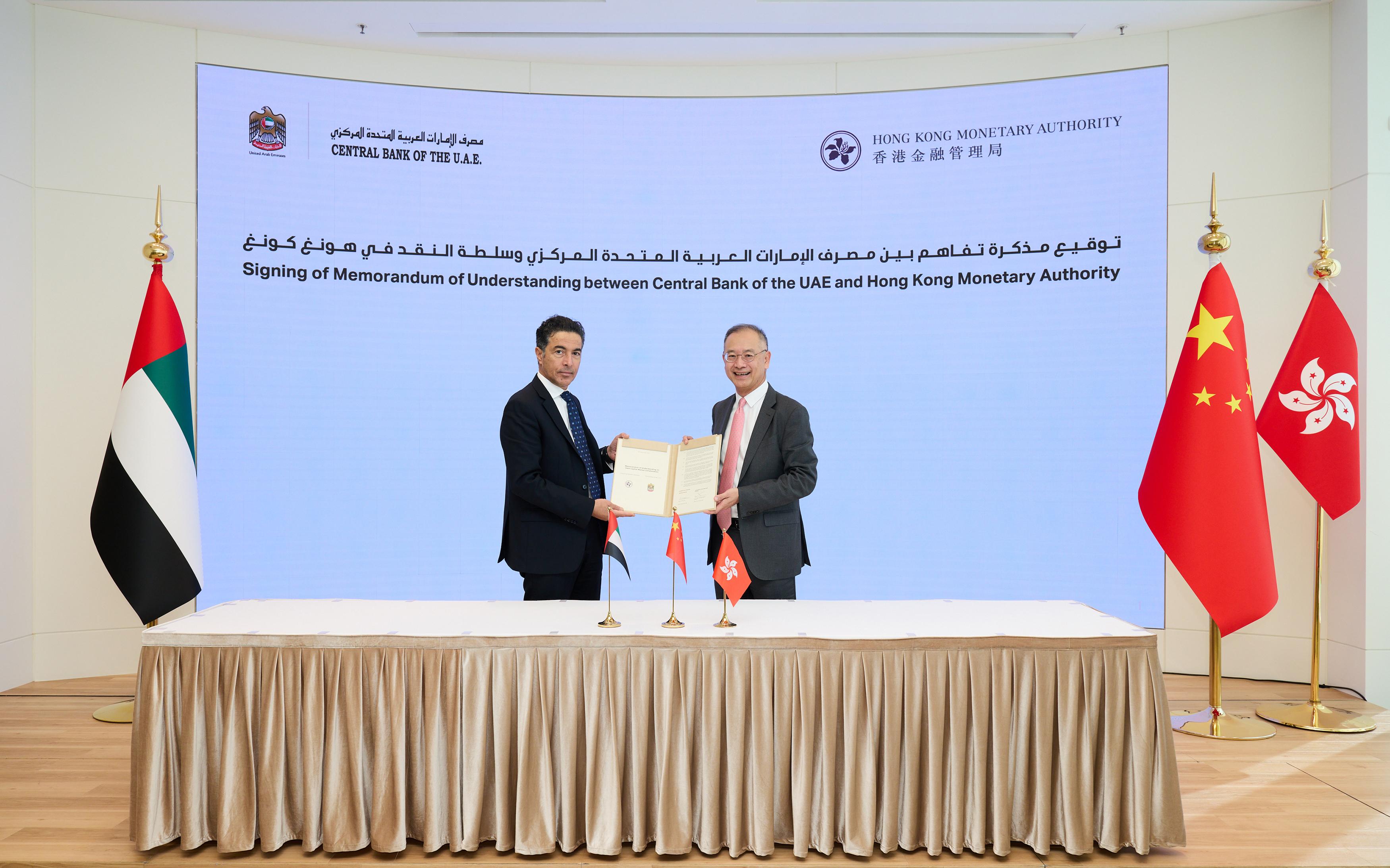 The Chief Executive of the Hong Kong Monetary Authority, Mr Eddie Yue (right), and the Governor of the Central Bank of the United Arab Emirates, H.E. Khaled Mohamed Balama (left), sign a Memorandum of Understanding today (December 20) to promote debt capital market collaboration.