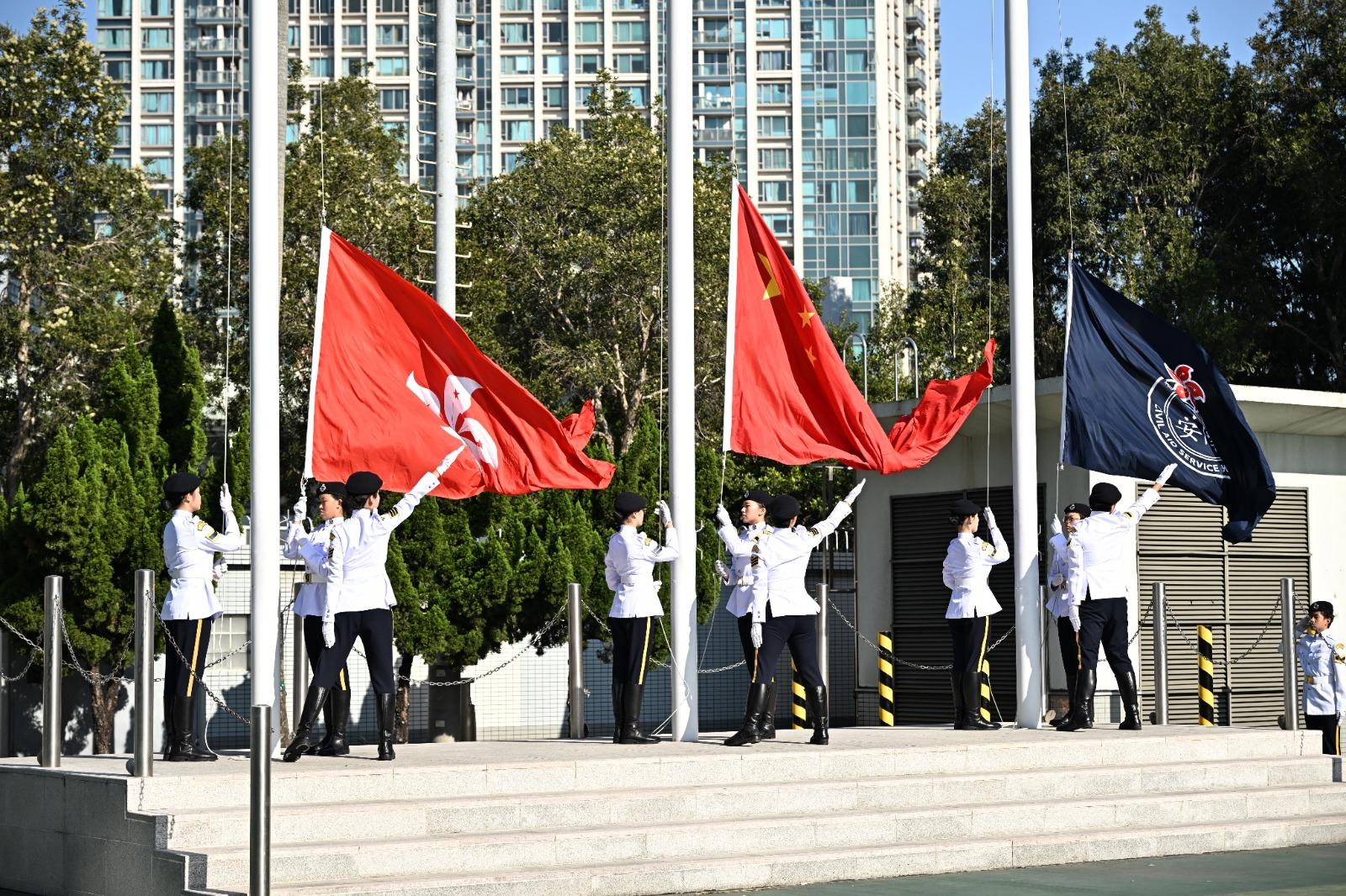 The Civil Aid Service Cadet Corps held the 145th New Cadets Passing-out Parade today (December 21). Photo shows the Cadet Corps Guard of Honour performing a flag-raising ceremony.