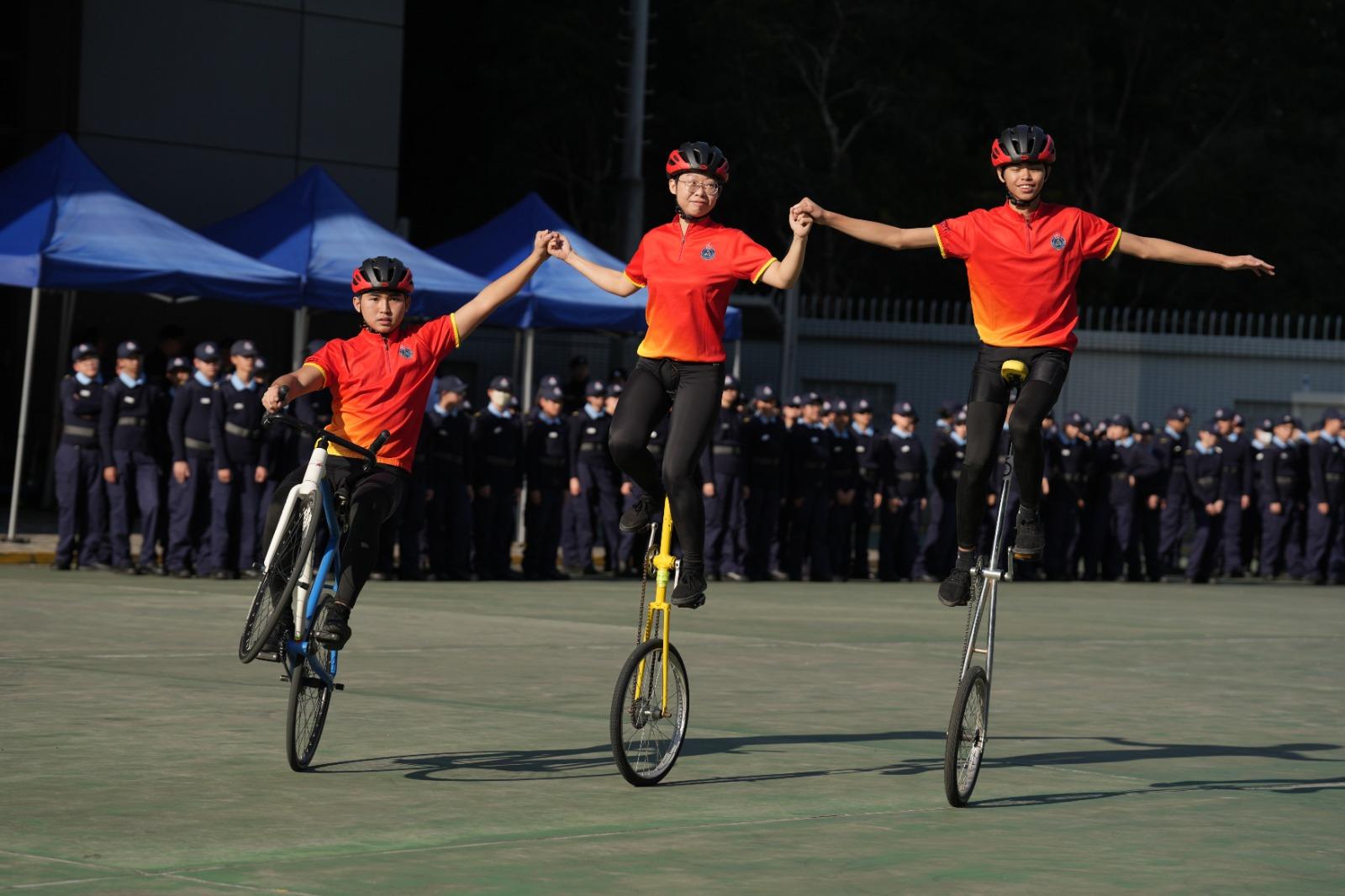 The Civil Aid Service (CAS) Cadet Corps held the 145th New Cadets Passing-out Parade today (December 21). Photo shows the CAS Cadet Corps Bicycle Demonstration Team performing after the parade.