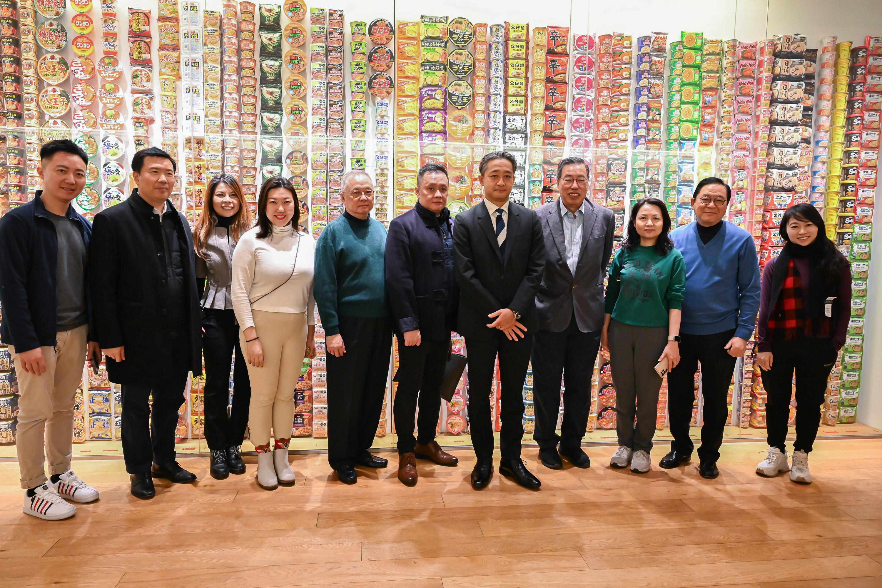 The Legislative Council (LegCo) delegation led by the President of LegCo, Mr Andrew Leung, continues its duty visit to Japan today (December 22). Photo shows Mr Leung (fourth right); the Chairman of the Parliamentary Liaison Subcommittee, Mr Tommy Cheung (fifth left) and other members of the delegation posing for a group photo with the Chairman and Chief Executive Officer of Nissin Foods Company Limited, Mr Kiyotaka Ando (fifth right); and the Principal Hong Kong Economic and Trade Representative (Tokyo), Miss Winsome Au (third left), at the Cup Noodles Museum.