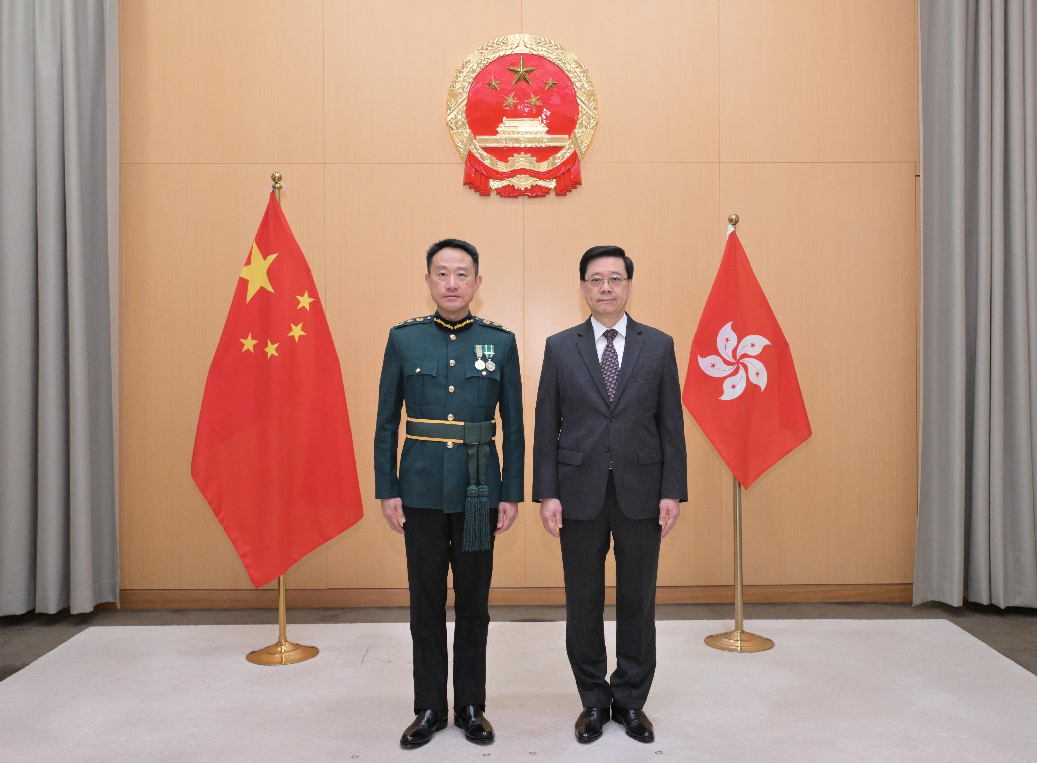 The Chief Executive, Mr John Lee (right), is pictured with the new Commissioner of Customs and Excise, Mr Chan Tsz-tat (left), today (December 31).