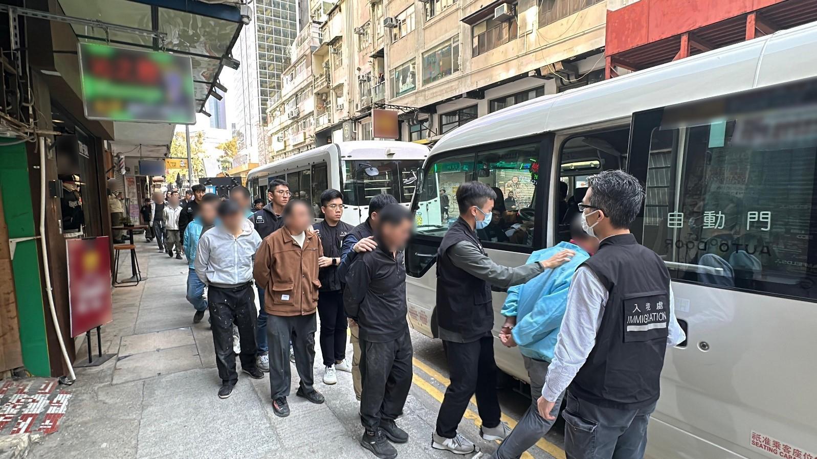 The Immigration Department mounted a series of territory-wide anti-illegal worker operations codenamed "Contribute" to combat illegal renovation workers from December 30 in 2024 to today (January 7). Photo shows suspected illegal workers arrested during the operation.