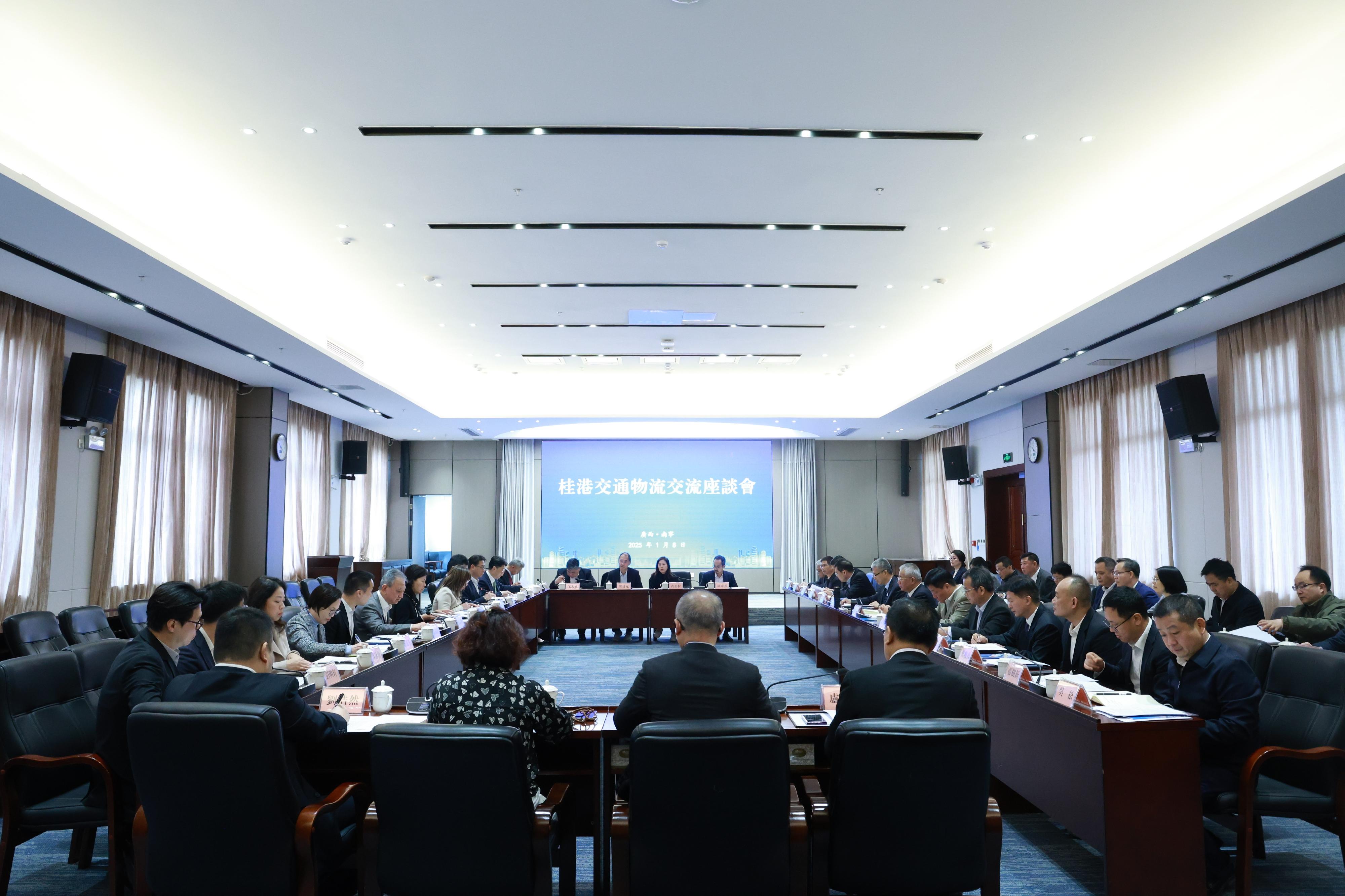 The Secretary for Transport and Logistics, Ms Mable Chan, continued to lead members of the Hong Kong Logistics Development Council to visit Guangxi today (January 8). Photo shows Ms Chan (seventh left) and the delegation attending a Guangxi-Hong Kong seminar on transport and logistics and exchanging views with the Director of the Transport Department of Guangxi Zhuang Autonomous Region, Mr Liu Ke (front row, seventh right), and other representatives.