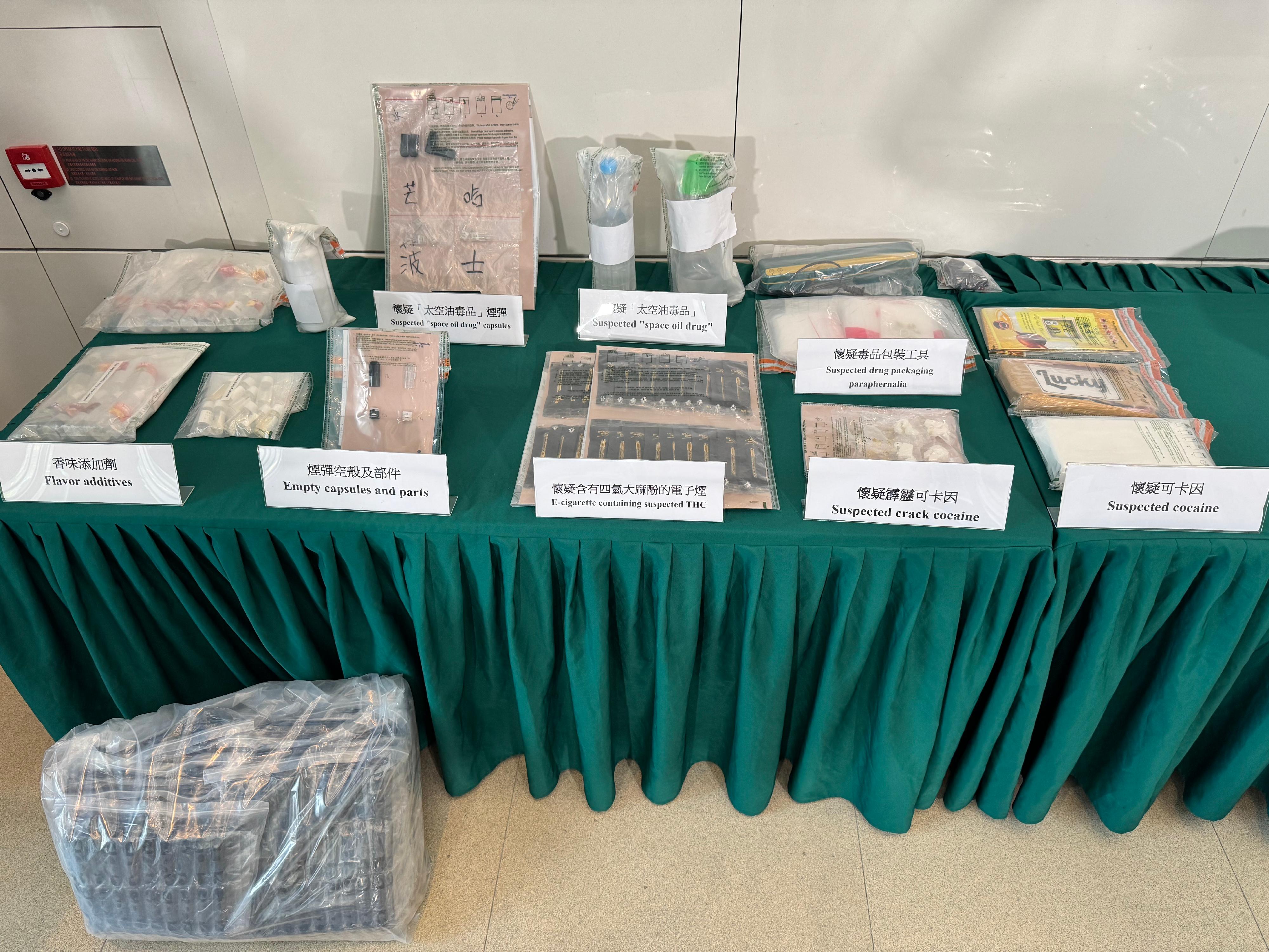 Hong Kong Customs conducted anti-narcotics operations and detected two dangerous drugs cases in Causeway Bay, Tai Po and Yuen Long yesterday (January 7). Photo shows suspected "space oil drug", suspected cocaine, suspected crack cocaine, suspected "space oil drug" capsules and vape sticks containing suspected tetrahydro-cannabinol seized in the second case.
