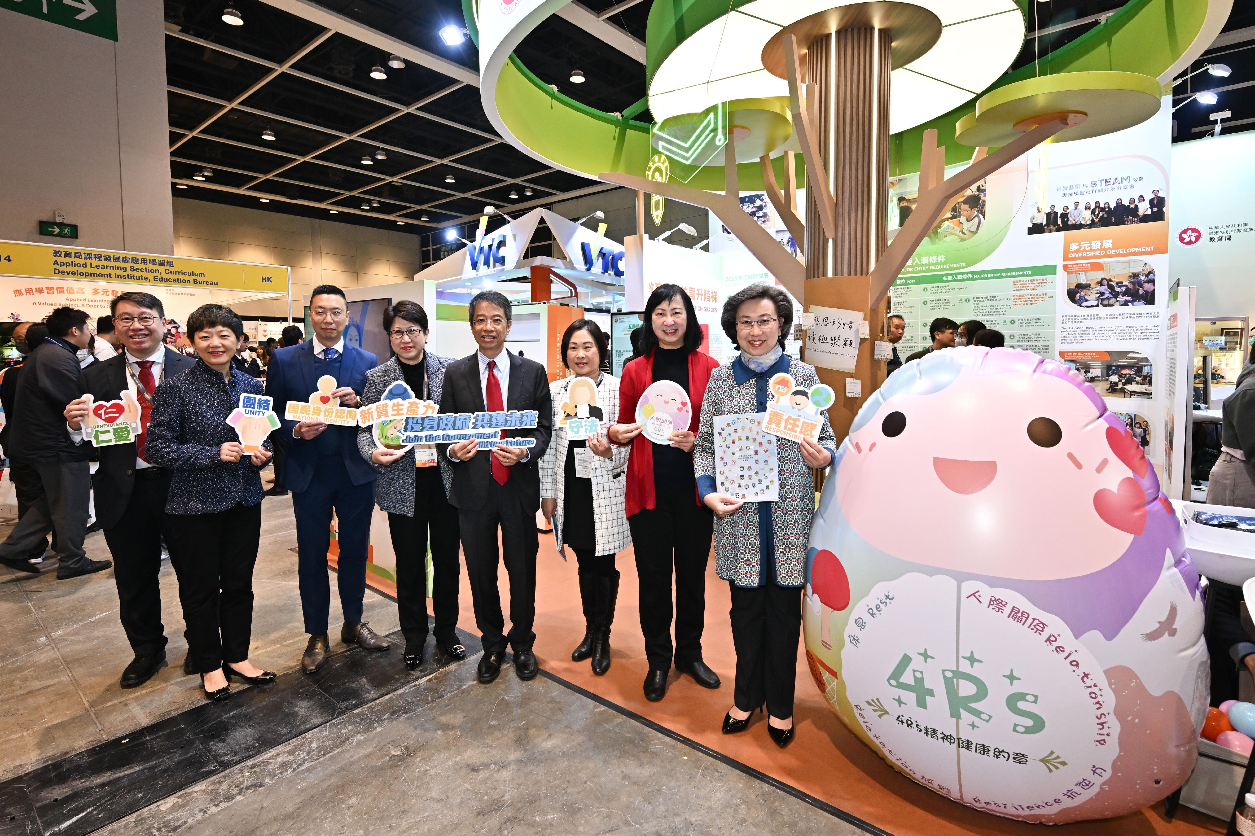 The Civil Service Bureau has curated an exhibition area at the Education & Careers Expo 2025 from today (January 16) for four consecutive days to introduce the work of over 50 government grades and provide the public with information on civil service recruitment to enhance job seekers' understanding of government jobs. The Secretary for the Civil Service, Mrs Ingrid Yeung (first right); the Permanent Secretary for the Civil Service, Mr Clement Leung (fourth right); the Permanent Secretary for Education, Ms Michelle Li, (second right); and Deputy Executive Director of Hong Kong Trade Development Council Ms Sophia Chong (fourth left), are pictured at the Education Bureau's booth.