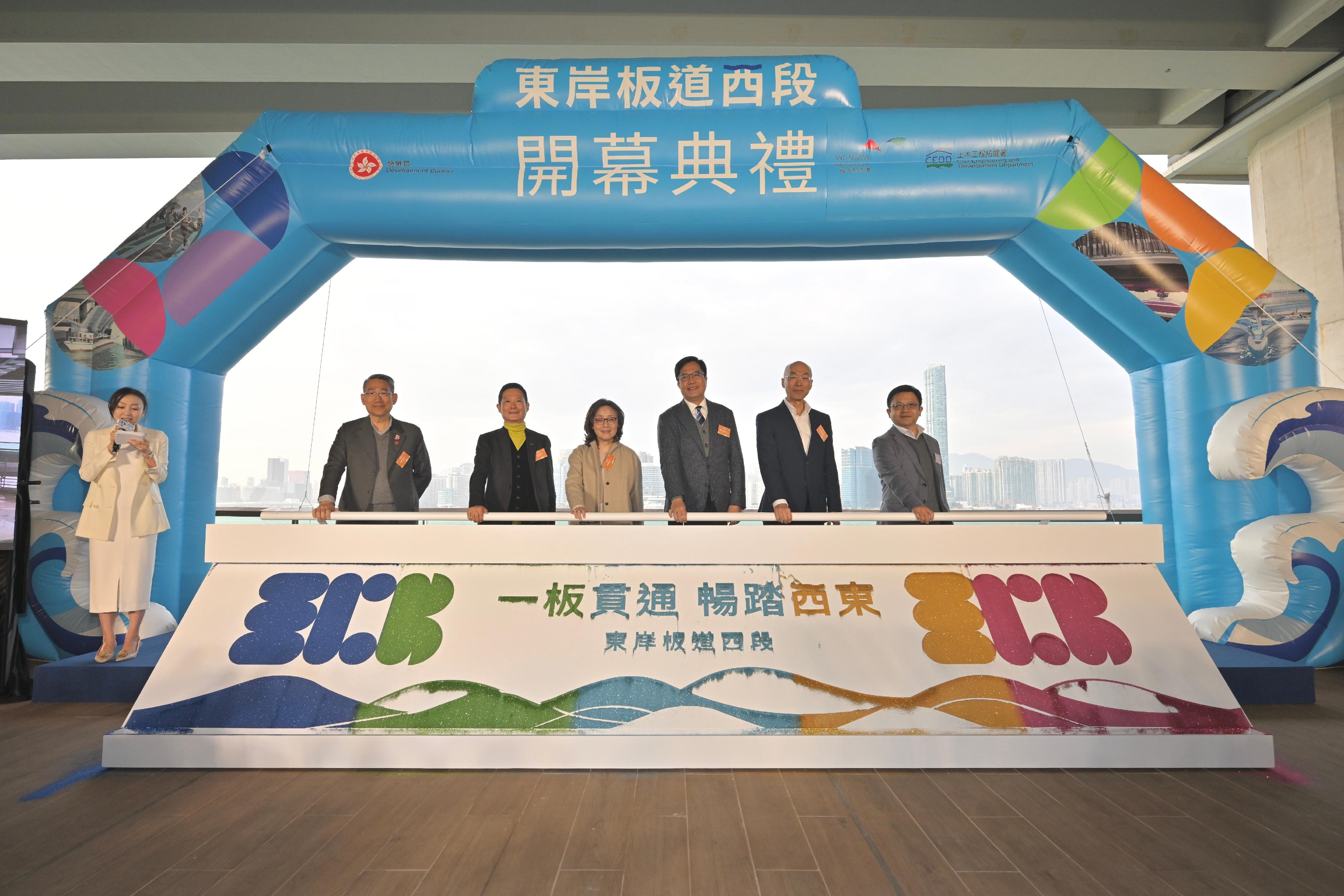 The East Coast Boardwalk (Western Section) underneath the Island Eastern Corridor in North Point, connecting the East Coast Park Precinct and the North Point Promenade, will open to the public this Sunday (January 26). Photo shows the Acting Financial Secretary, Mr Michael Wong (third right); the Secretary for Development, Ms Bernadette Linn (third left); the Chairman of the Harbourfront Commission, Mr Ivan Ho (second left); the Director of Civil Engineering and Development, Mr Michael Fong (second right); the Project Manager (South) of the Civil Engineering and Development Department, Mr Victor Chan (first right); and the District Officer (Eastern), Mr Simon Chan (first left), officiating at the opening ceremony today (January 23).