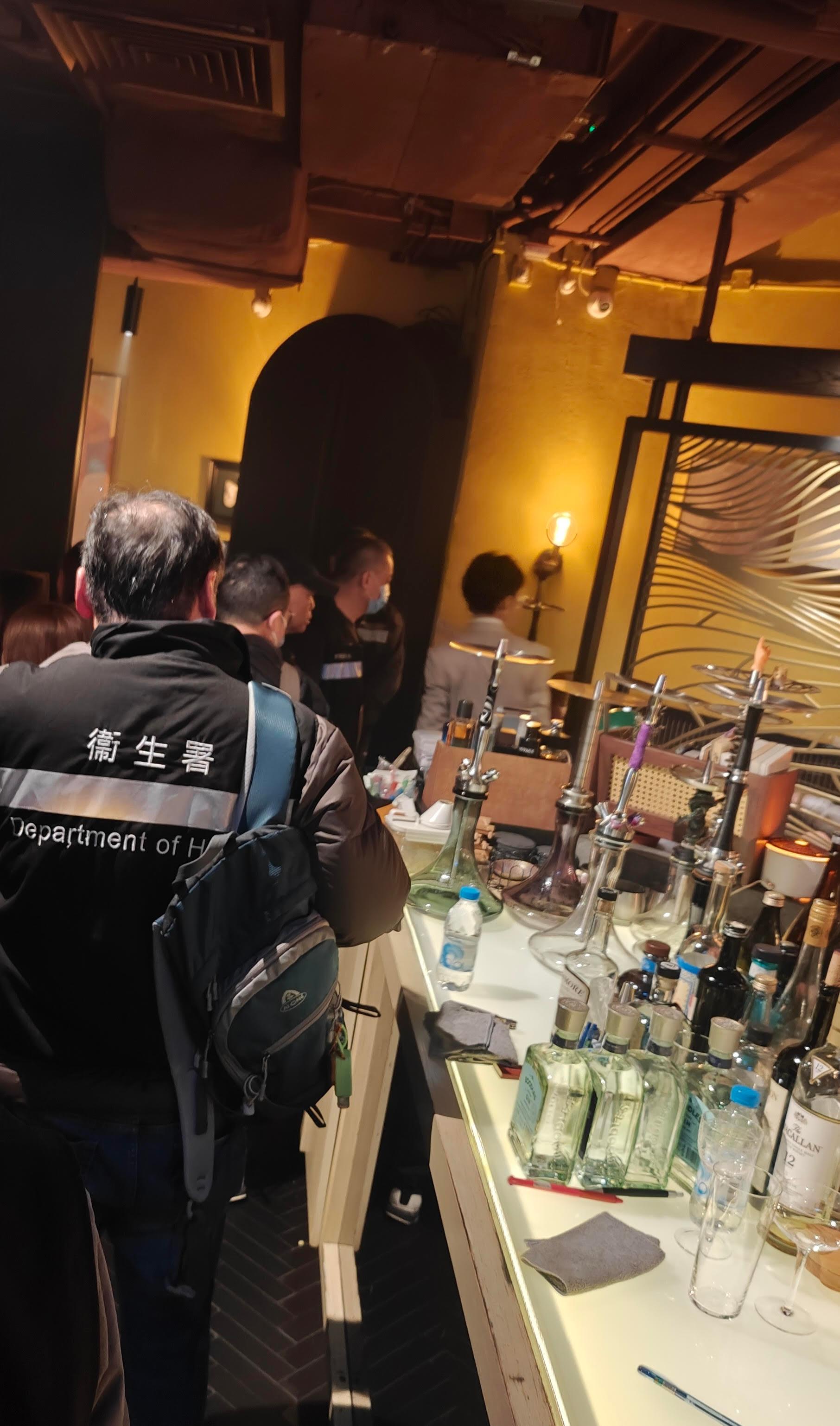The Tobacco and Alcohol Control Office (TACO) of the Department of Health (DH) conducted an enforcement operation, codenamed "Pipepurge", in Wan Chai district last night (January 24) against illegal waterpipe smoking activities in no smoking areas. Photo shows the TACO officers taking enforcement action inside a bar.
