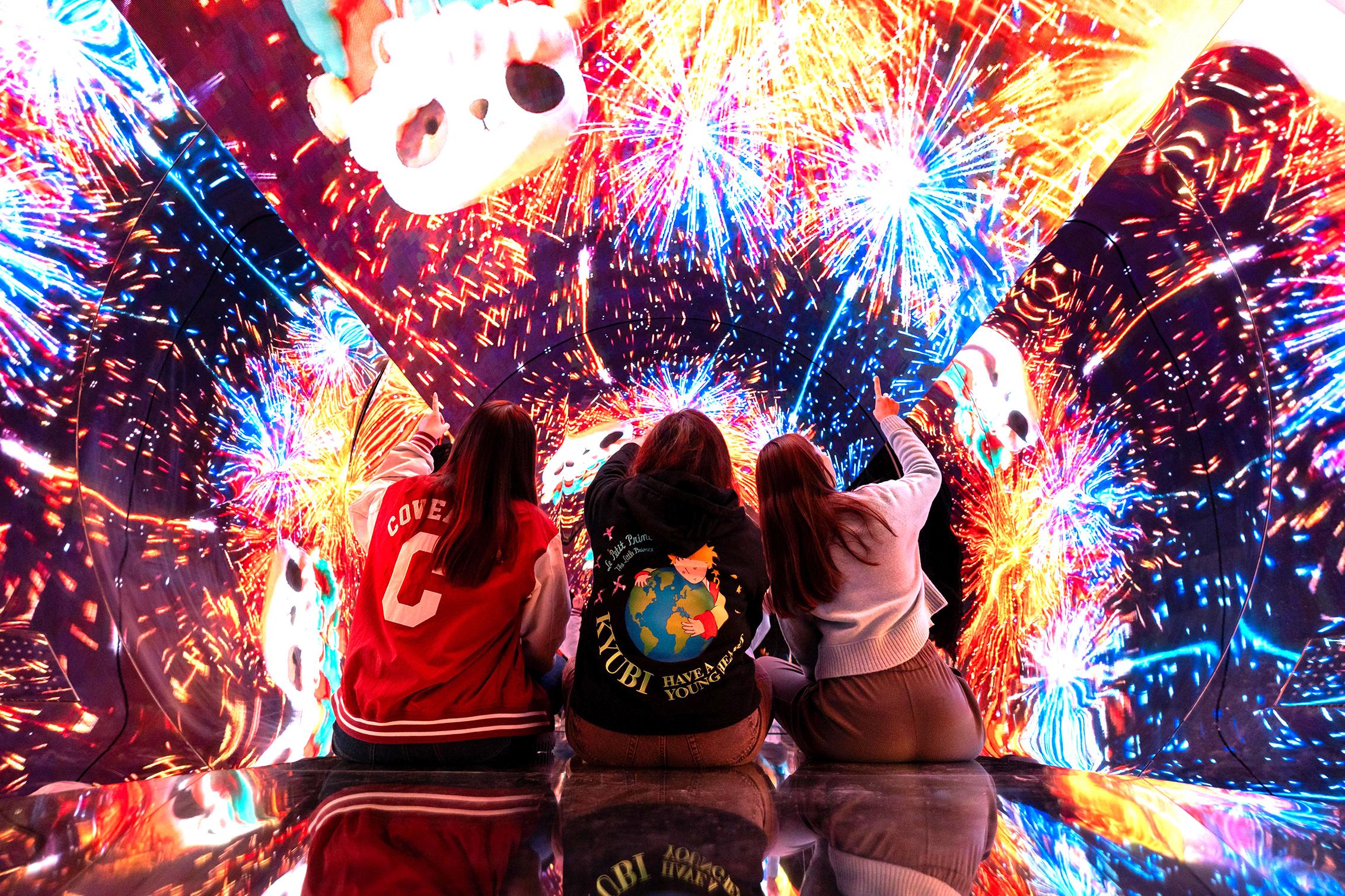 The Hong Kong Housing Authority has put up various festive Lunar New Year decorations with the theme "Lion Dance, New Attire and Dream Building" at Domain, its regional shopping centre in Yau Tong. Photo shows an immersive light installation with delightful panda images.
