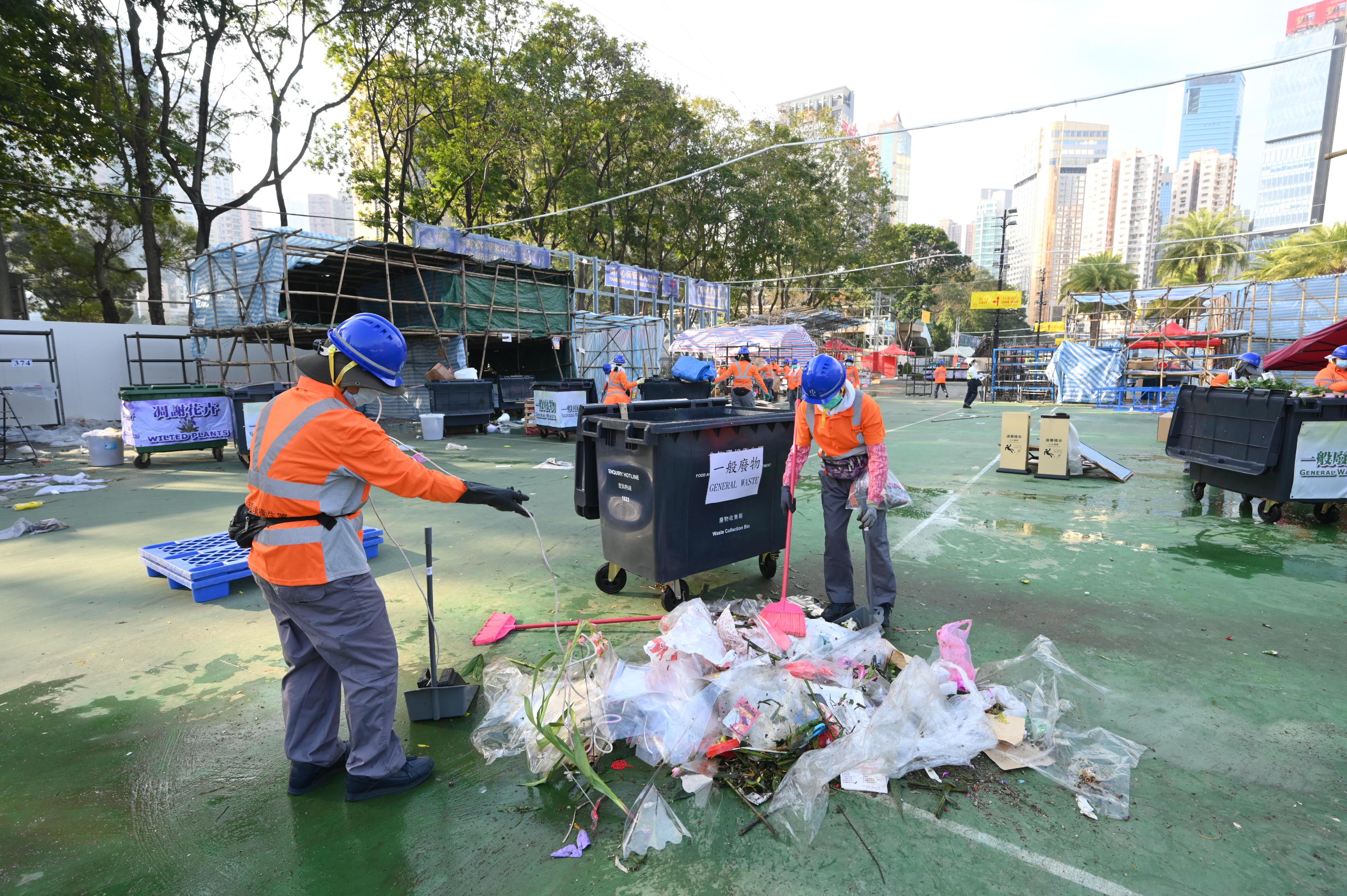 The 2025 Lunar New Year (LNY) fairs concluded successfully at 7am today (January 29). Photo shows cleansing workers cleaning up the Victoria Park LNY Fair site after the fair ended.