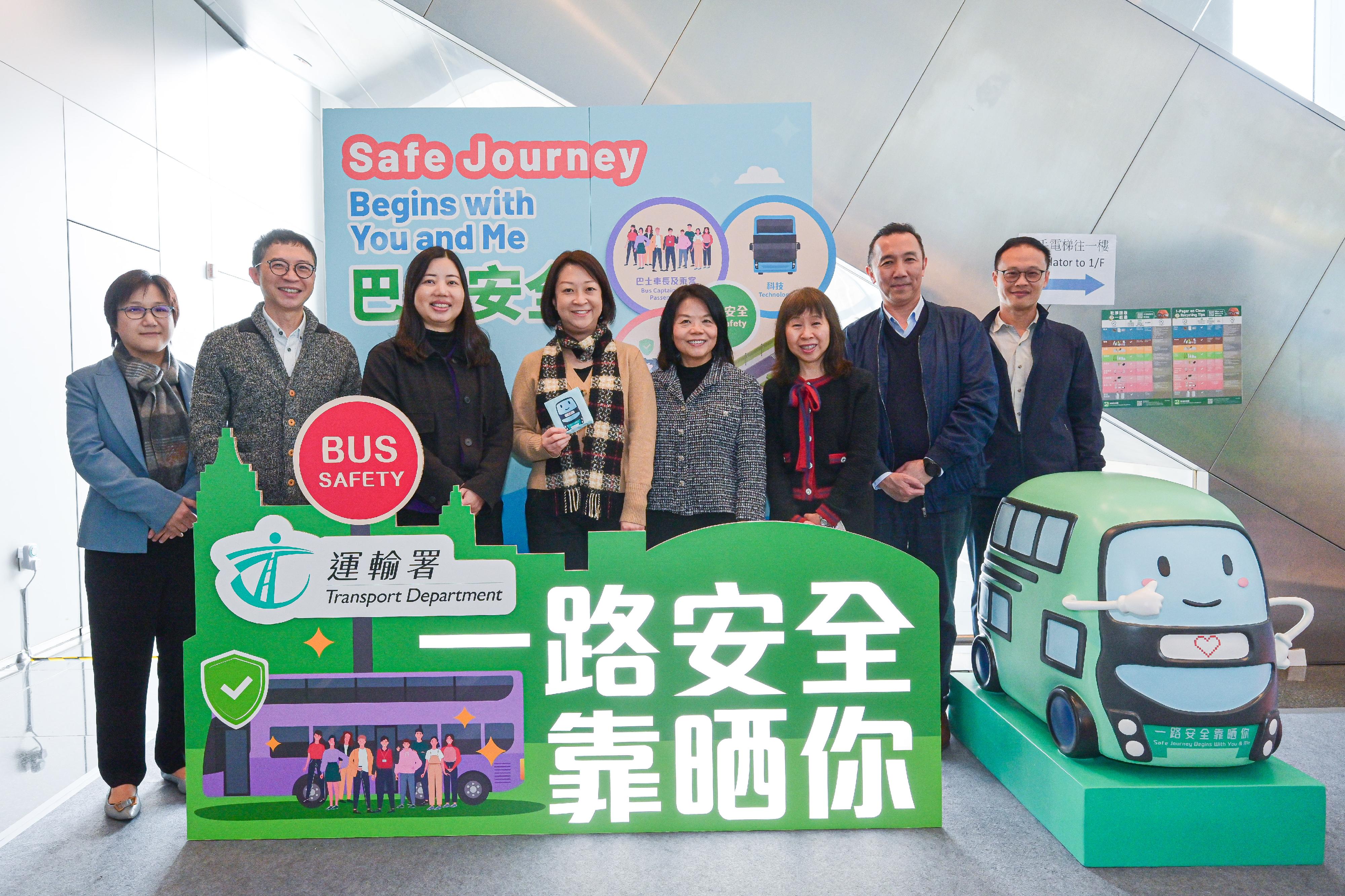 The Transport Department (TD) will hold the "Safe Journey Begins with You and Me" bus safety roving exhibition at nine government buildings from today (February 3) to mid-May to feature the efforts of both the Government and franchised bus operators in improving bus safety and enhancing public awareness on passenger safety. Its first stop is the G/F Lobby, South Tower, West Kowloon Government Offices. Members of the public are most welcome to visit. Photo shows the Commissioner for Transport, Ms Angela Lee (fourth left); the Deputy Commissioner for Transport/Transport Services and Management, Ms Candy Kwok (third left); the Safety Director of the TD, Ms Stella Lee (fourth right), and officers of the Franchised Bus Safety Team.