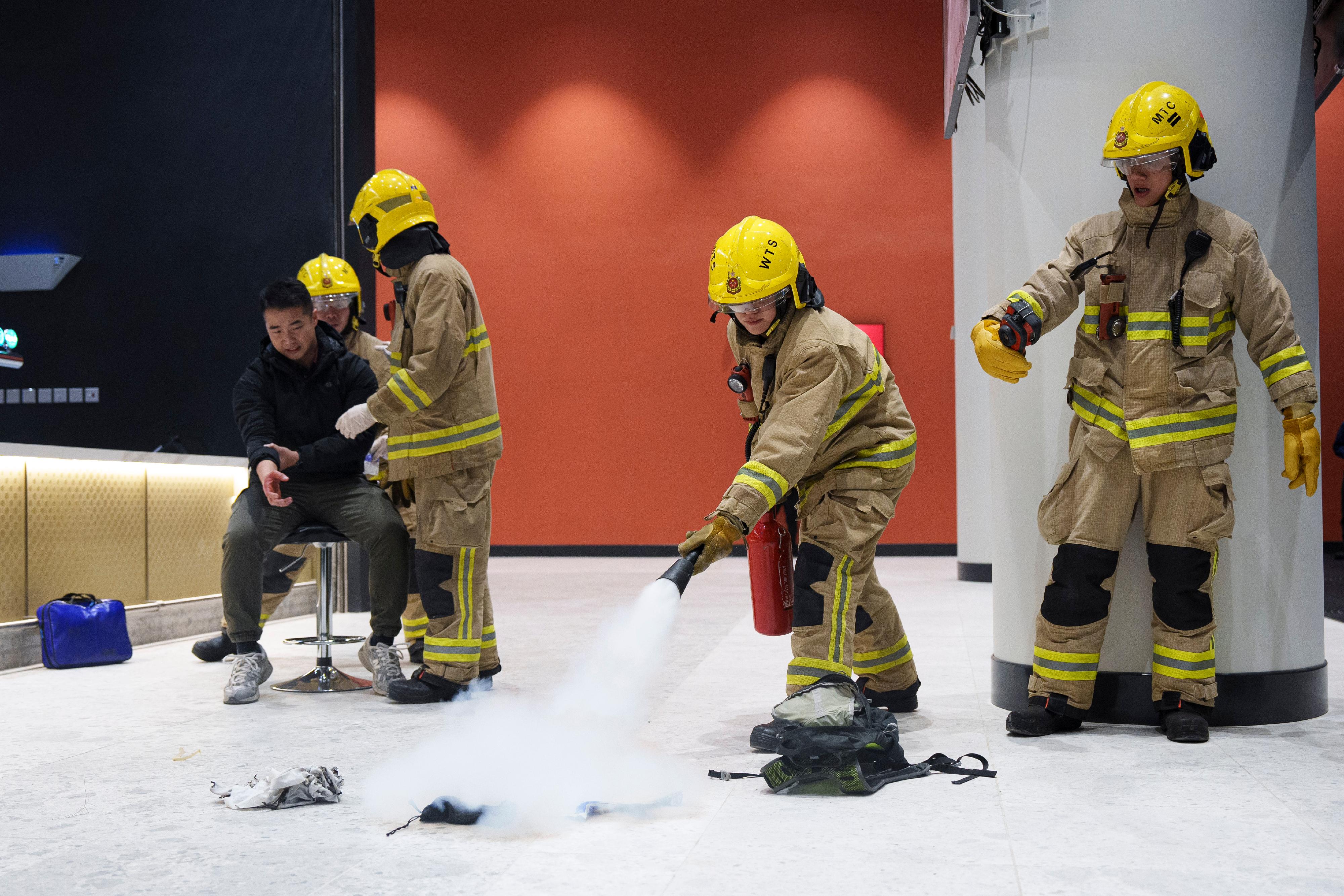 A large-scale stress test was conducted at Kai Tak Sports Park today (February 4). Photo shows firemen simulating the extinguishing of a small-scale fire and treating an injured person.