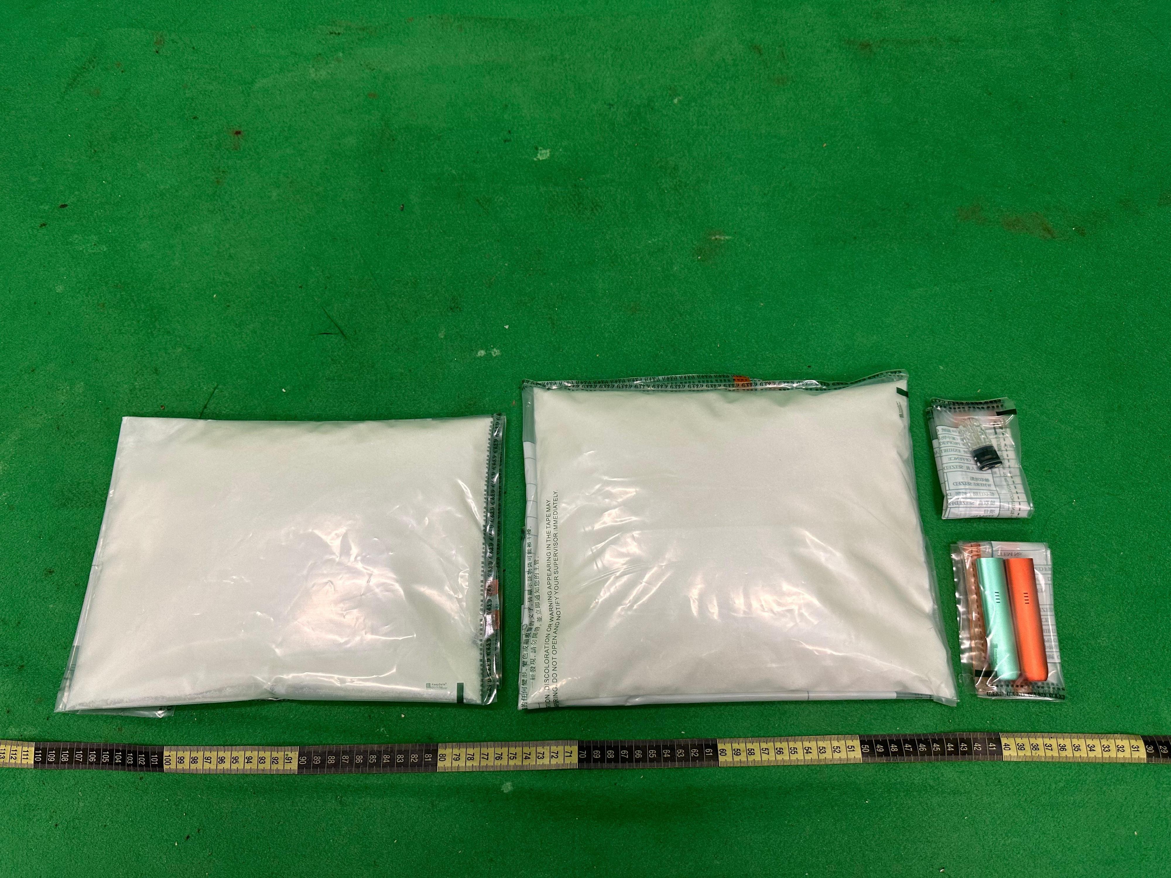 Hong Kong Customs detected a case involving etomidate (the main ingredient of "space oil drug"), a kind of Part 1 poison under the Pharmacy and Poisons Regulations at Hong Kong International Airport and seized about 3 kilograms of suspected "space oil drug" with an estimated market value of about $3.2 million on January 8. Photo shows the suspected "space oil drug", "space oil drug" infused capsule and vape devices seized.
