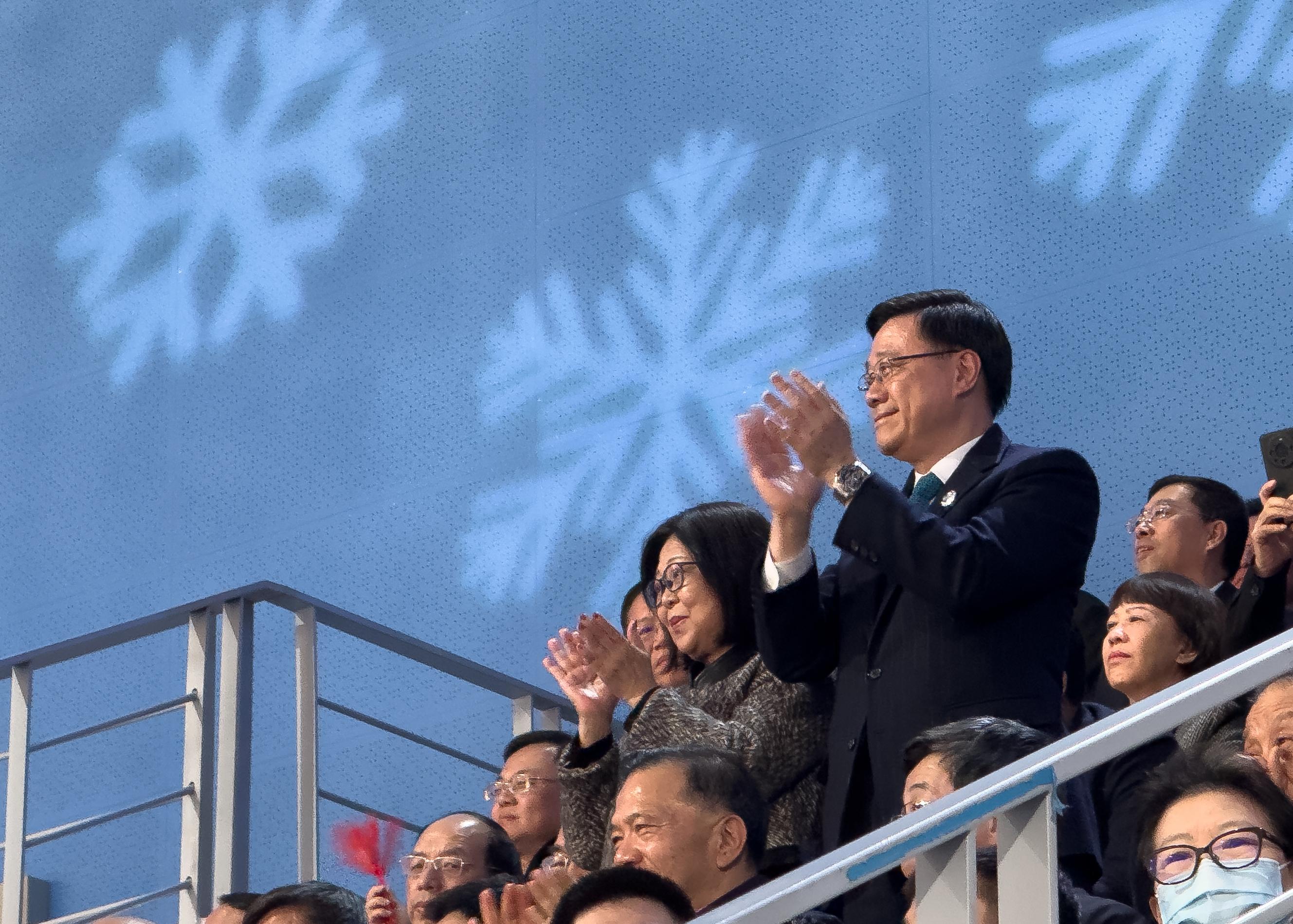 The Chief Executive, Mr John Lee, began his visit in Harbin today (February 7). Photo shows Mr Lee, and his wife Mrs Janet Lee, attending the opening ceremony of the 9th Asian Winter Games Harbin 2025 and welcoming members of the Hong Kong, China Delegation entering the ceremony.
