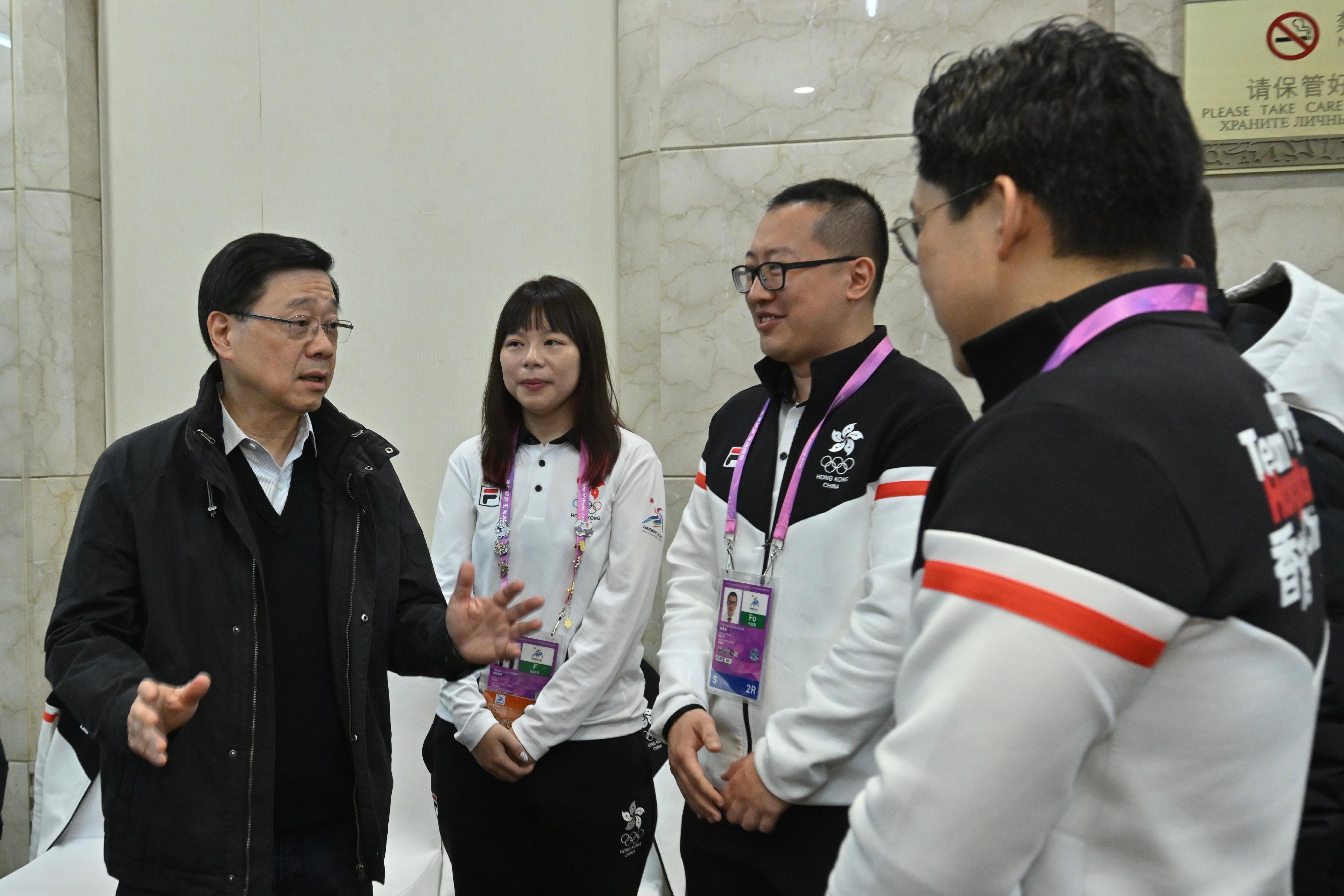 The Chief Executive, Mr John Lee, continued his visit programme in Harbin today (February 8). Photo shows Mr Lee (first left) visiting members of the Hong Kong, China Delegation at the athletes' village of the 9th Asian Winter Games Harbin 2025.