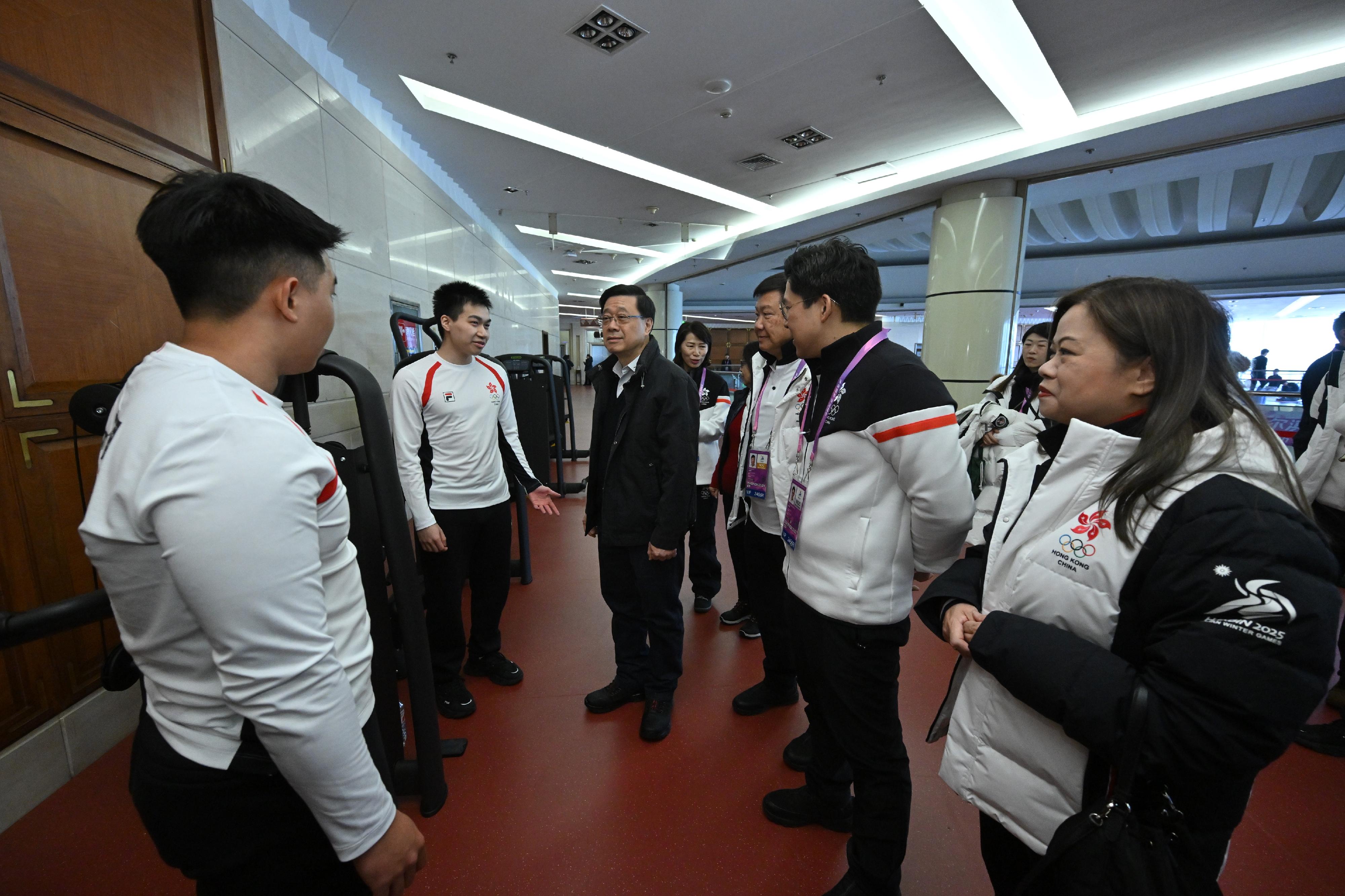The Chief Executive, Mr John Lee, continued his visit programme in Harbin today (February 8). Photo shows Mr Lee (third left) visiting members of the Hong Kong, China Delegation at the athletes' village of the 9th Asian Winter Games Harbin 2025.