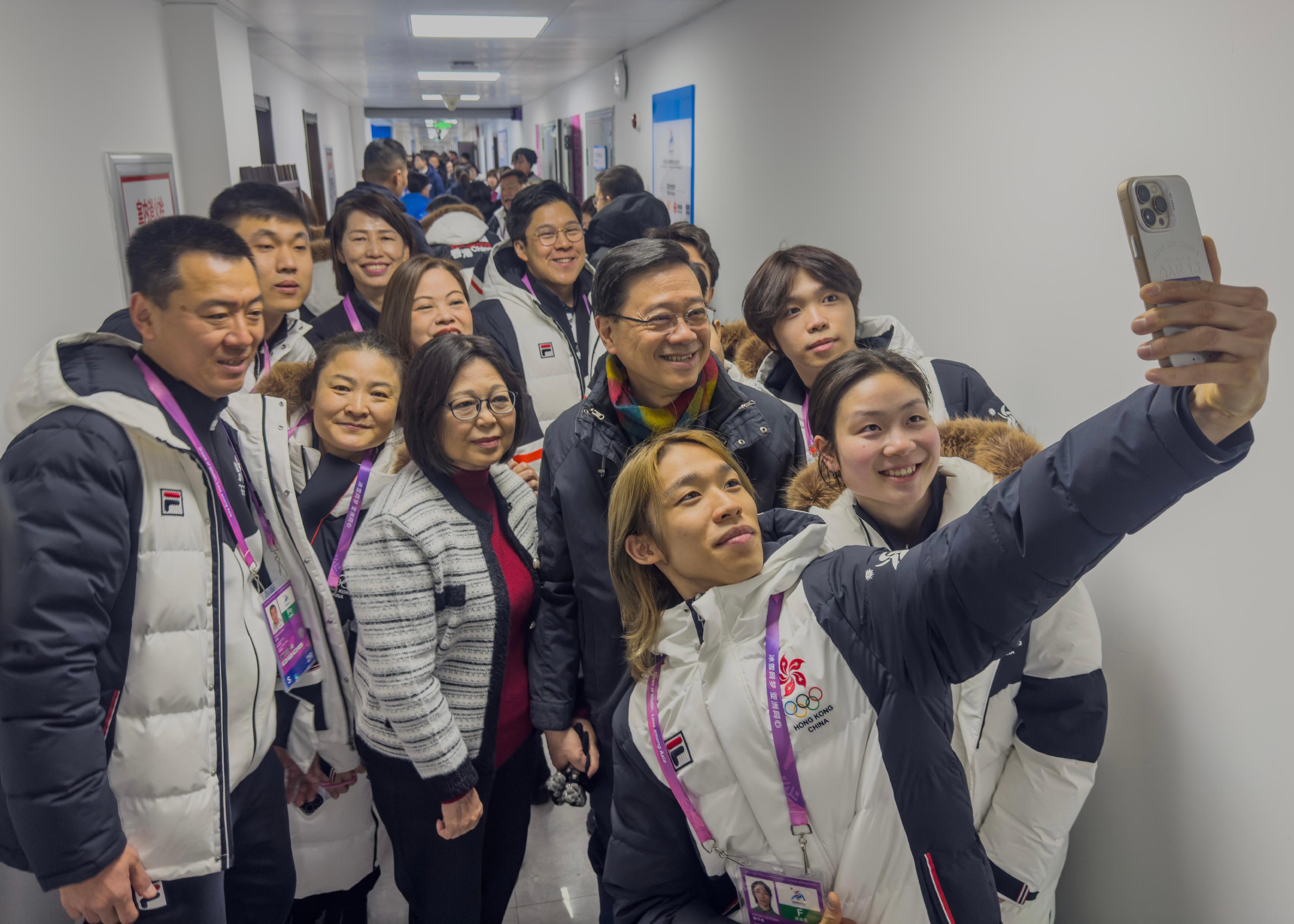 The Chief Executive, Mr John Lee, continued his visit programme in Harbin today (February 8). Photo shows Mr Lee (second row, second right) and his wife Mrs Janet Lee (second row, third right), interacting with Hong Kong athletes after watching a competition at the 9th Asian Winter Games Harbin 2025.