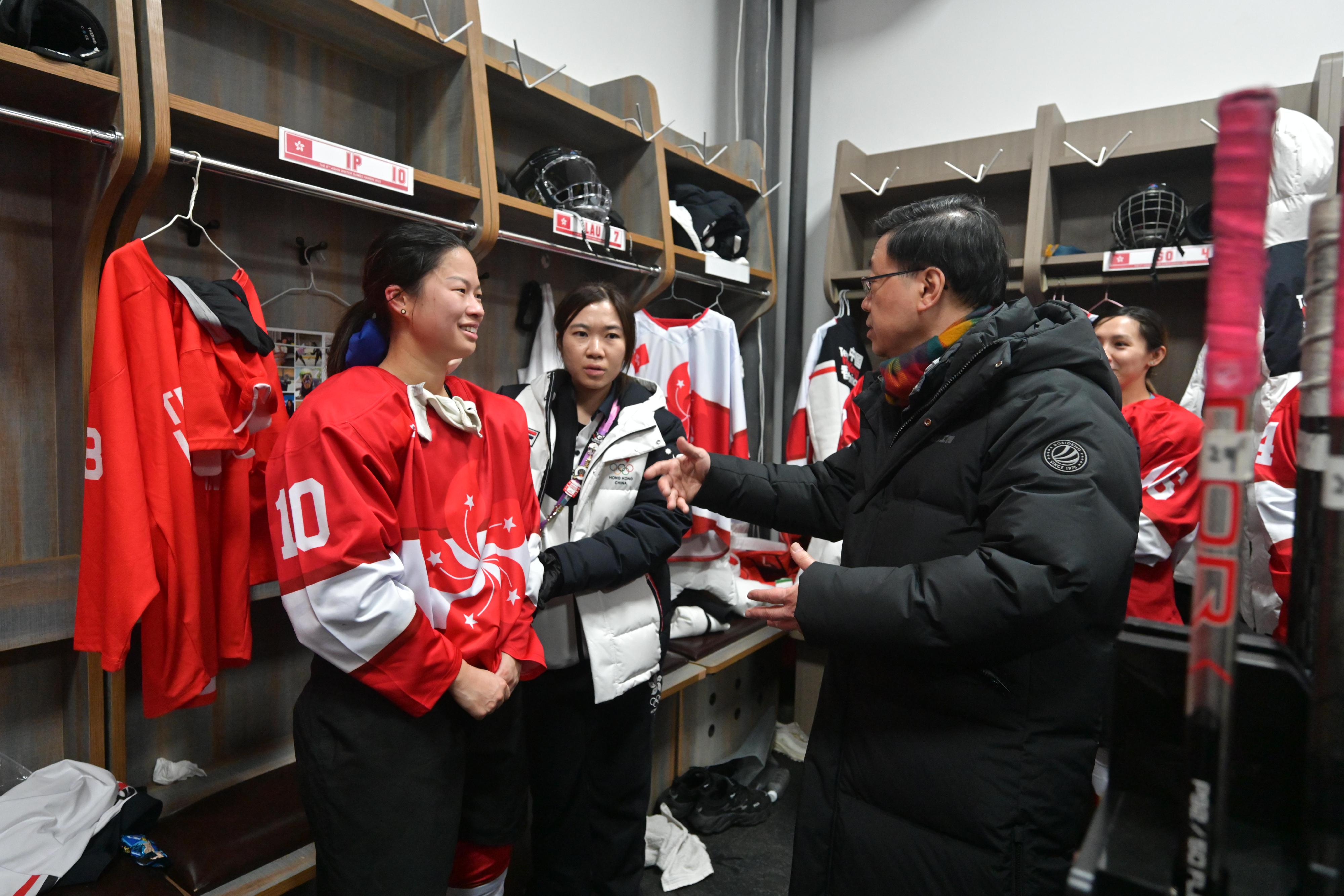The Chief Executive, Mr John Lee, continued his visit programme in Harbin today (February 8). Photo shows Mr Lee (first right) interacting with Hong Kong athletes after watching a women's ice hockey competition at the 9th Asian Winter Games Harbin 2025.