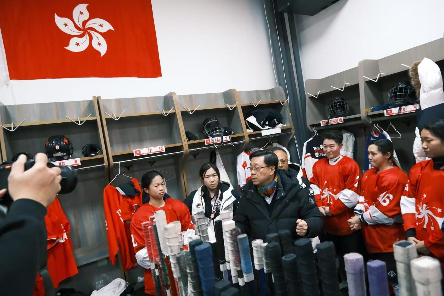 The Chief Executive, Mr John Lee, continued his visit programme in Harbin today (February 8). Photo shows Mr Lee (third left) interacting with Hong Kong athletes after watching a women's ice hockey competition at the 9th Asian Winter Games Harbin 2025.