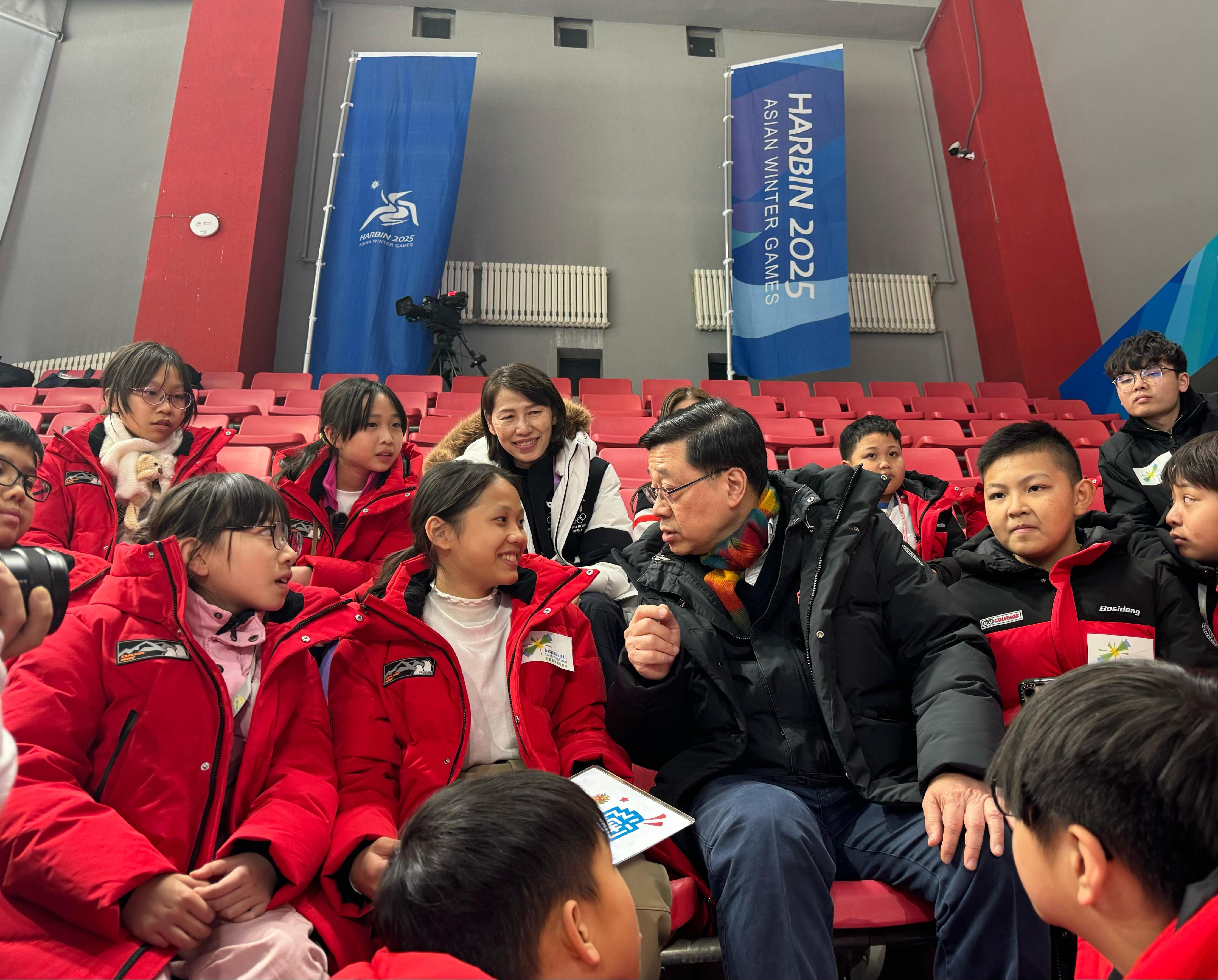 The Chief Executive, Mr John Lee, continued his visit programme in Harbin today (February 8). Photo shows Mr Lee (first row, third left) meeting with Hong Kong young people participating in an exchange programme of the 9th Asian Winter Games Harbin 2025 organised by InspiringHK Sports Foundation.