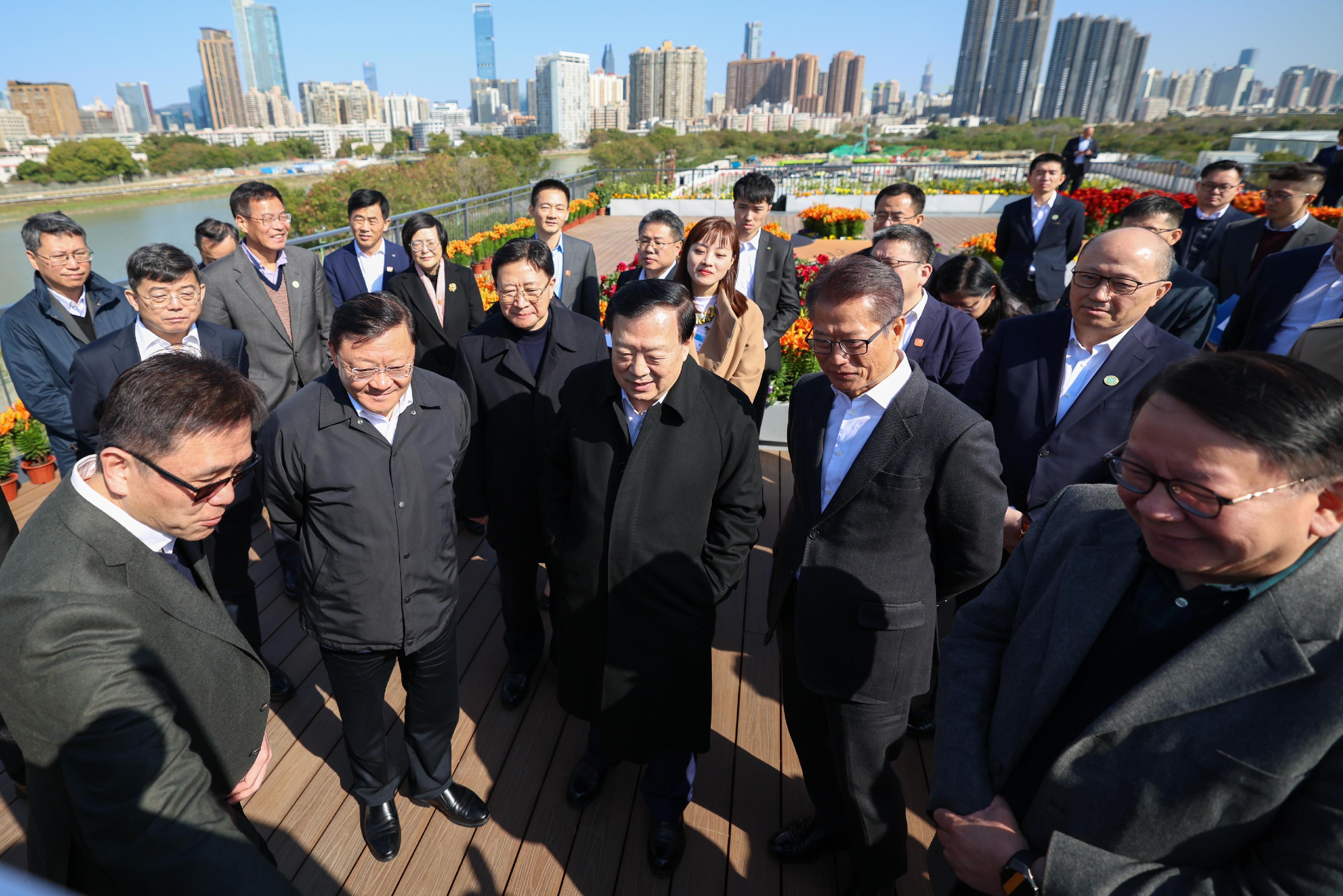 The Director of the Hong Kong and Macao Work Office of the Communist Party of China Central Committee and the Hong Kong and Macao Affairs Office (HKMAO) of the State Council, Mr Xia Baolong (first row, centre), inspected the Hong Kong Park of the Hetao Shenzhen-Hong Kong Science and Technology Innovation Co-operation Zone yesterday (February 9). Looking on are the Governor of Guangdong Province and Deputy Head of the Office of the Leading Group on Construction of the Guangdong-Hong Kong-Macao Greater Bay Area of Guangdong Province, Mr Wang Weizhong (first row, second left); Executive Deputy Director of the Hong Kong and Macao Work Office of the Communist Party of China Central Committee and the HKMAO of the State Council, Mr Zhou Ji (second row, second left); Deputy Director of the Hong Kong and Macao Work Office of the Communist Party of China Central Committee and Director of the Liaison Office of the Central People's Government in the Hong Kong Special Administrative Region, Mr Zheng Yanxiong (second row, first right); the Acting Chief Executive, Mr Chan Kwok-ki (first row, first right); the Financial Secretary, Mr Paul Chan (first row, second right); and the Secretary for Innovation, Technology and Industry, Professor Sun Dong (first row, first left).