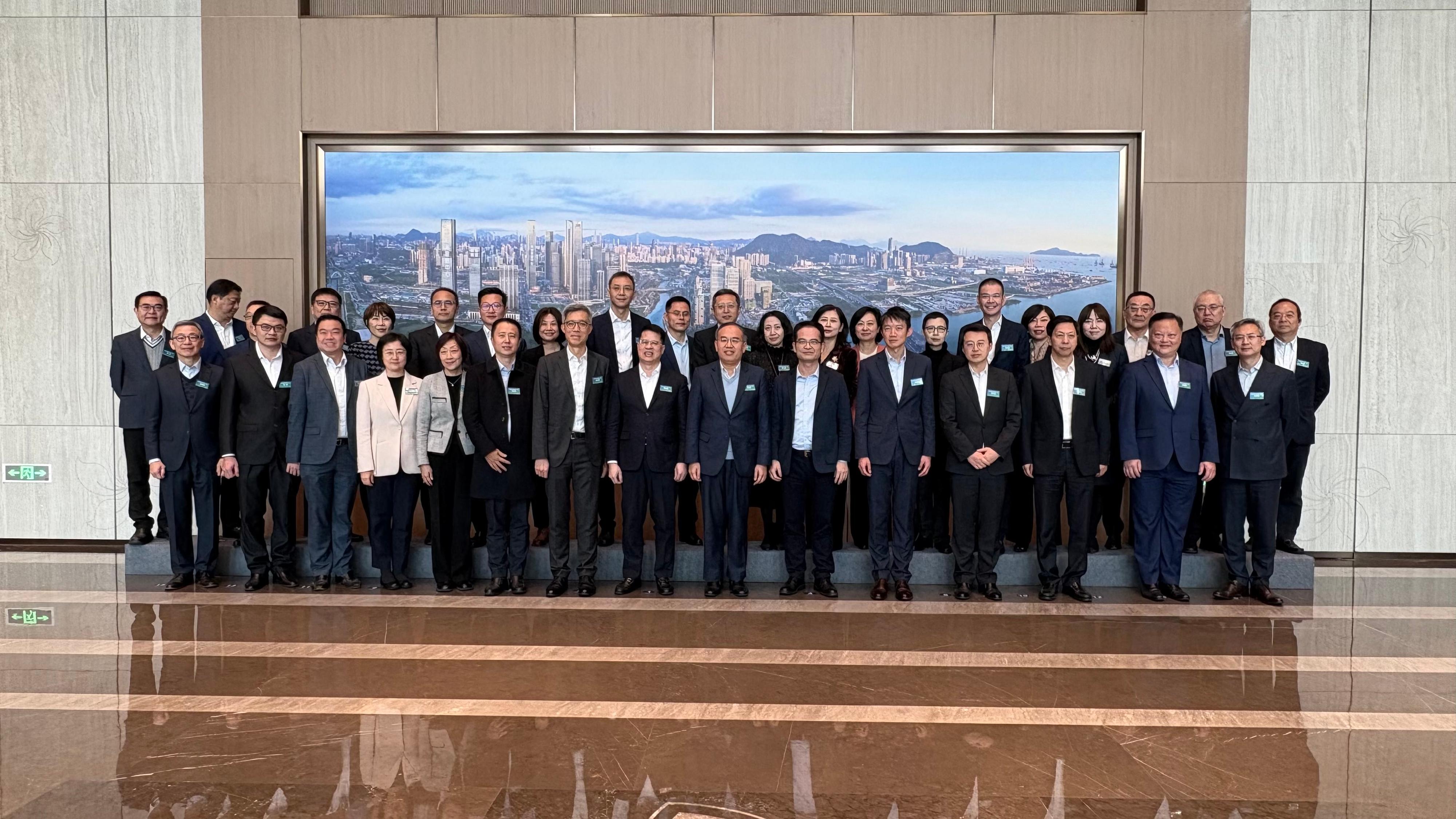 The Shenzhen-Hong Kong Financial Co-operation Committee convened its second meeting in Qianhai, Shenzhen, today (February 13). The meeting was co-chaired by the Secretary for Financial Services and the Treasury, Mr Christopher Hui, and the Vice-Mayor of the Shenzhen Municipal People's Government and Director General of the Office of the Financial Affairs Committee of the CPC Shenzhen Municipal Committee, Mr Luo Huanghao. Representatives of government bodies, financial regulators, exchanges and non-official members of the two places are pictured before the meeting. Starting from the front row, sixth left, are the Director of the Shenzhen Municipal Financial Regulatory Bureau, Mr Shi Weigan; the Acting Permanent Secretary for Financial Services and the Treasury (Financial Services), Mr Francis Ho; Mr Luo; Mr Hui; and the Deputy Secretary-General of the Shenzhen Municipal People's Government, Mr Wu Kunsheng.
