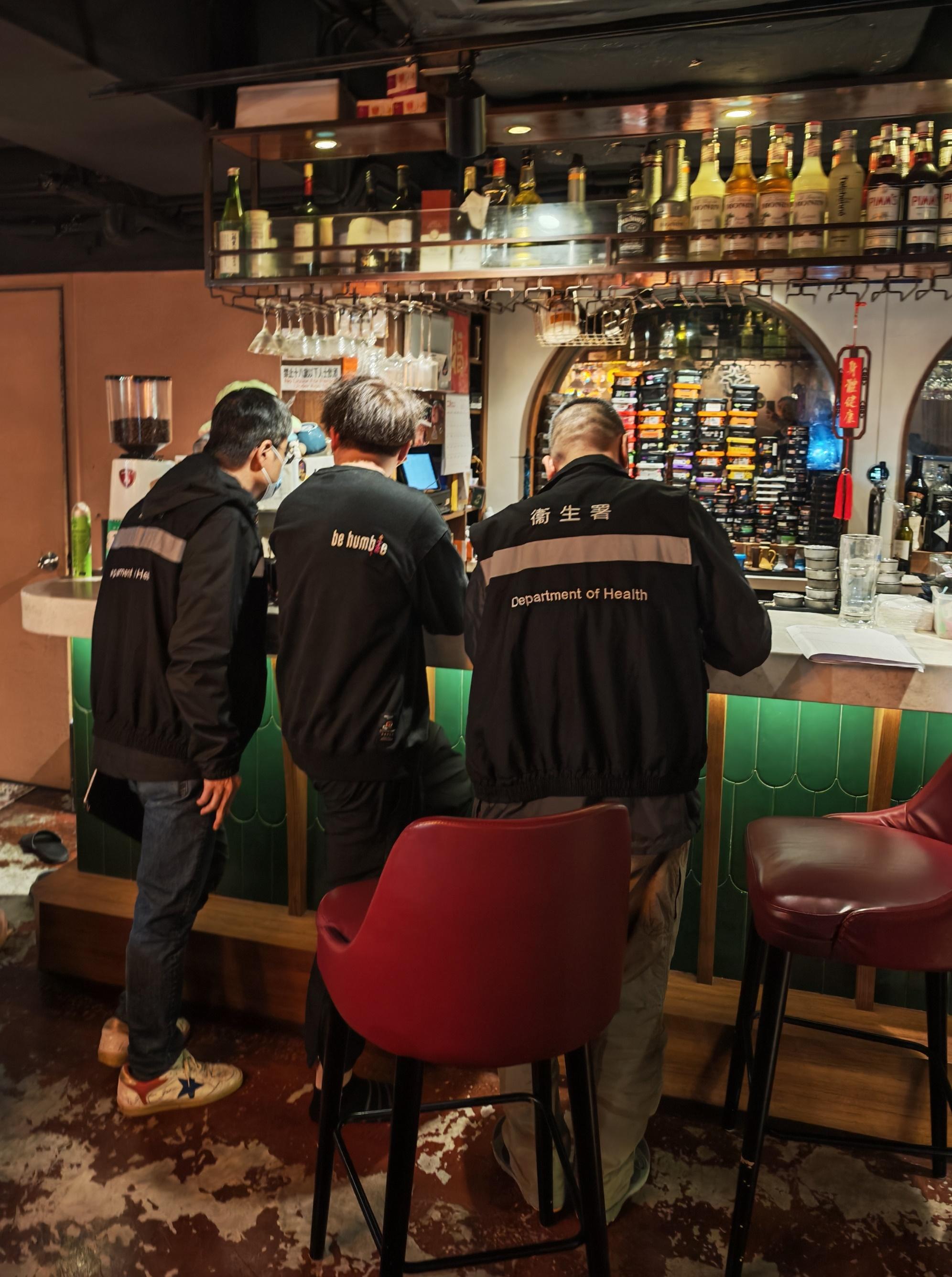 The Tobacco and Alcohol Control Office (TACO) of the Department of Health conducted an enforcement operation, codenamed "Pipepurge", in Mong Kok last night (February 13) against illegal waterpipe smoking activities in no smoking areas and a total of three fixed penalty notices were issued. Photo shows TACO officers taking enforcement action inside a bar. 
