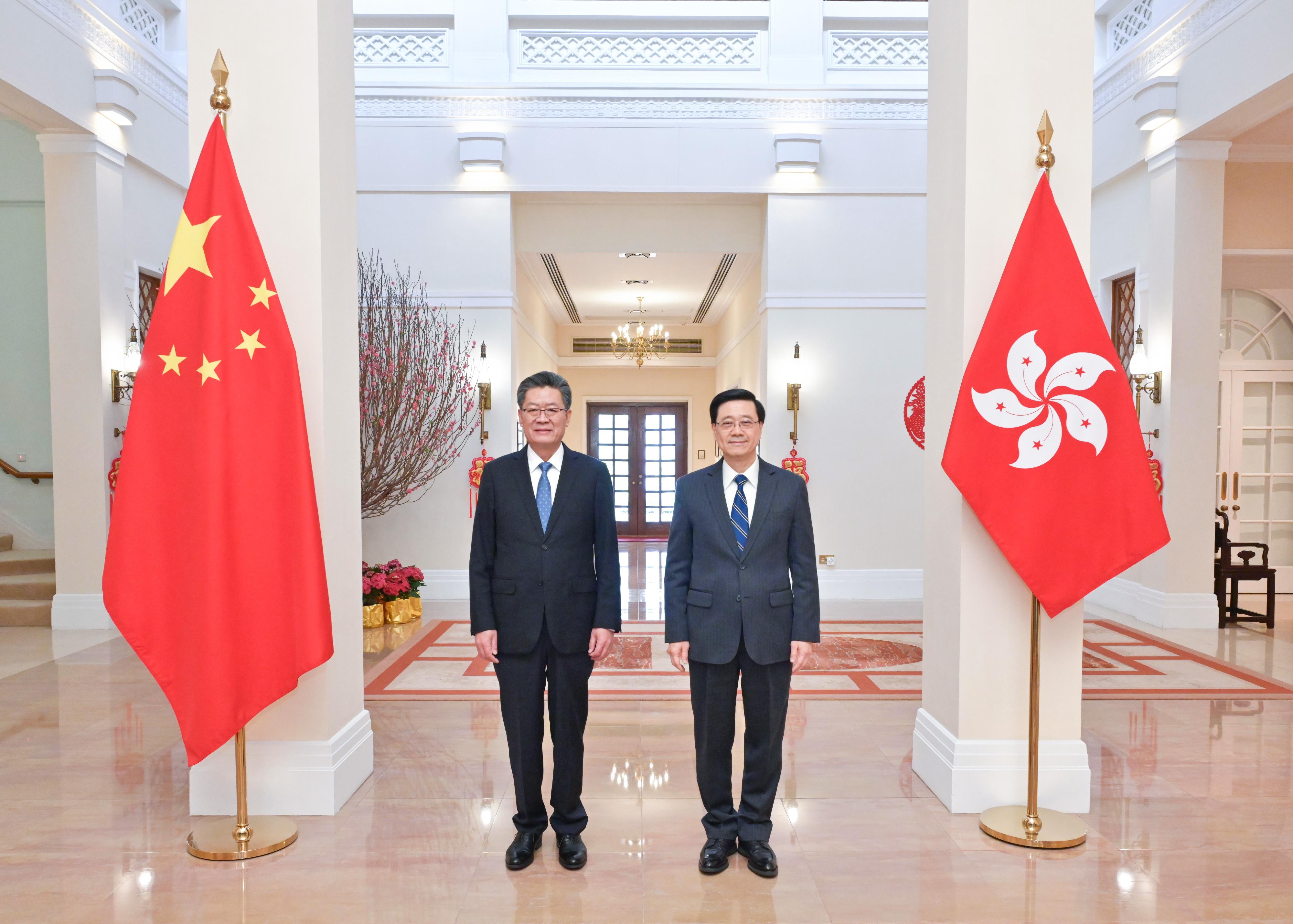 The Chief Executive, Mr John Lee (right), meets with the Secretary of the CPC Guangzhou Municipal Committee, Mr Guo Yonghang (left), at Government House today (February 14), 