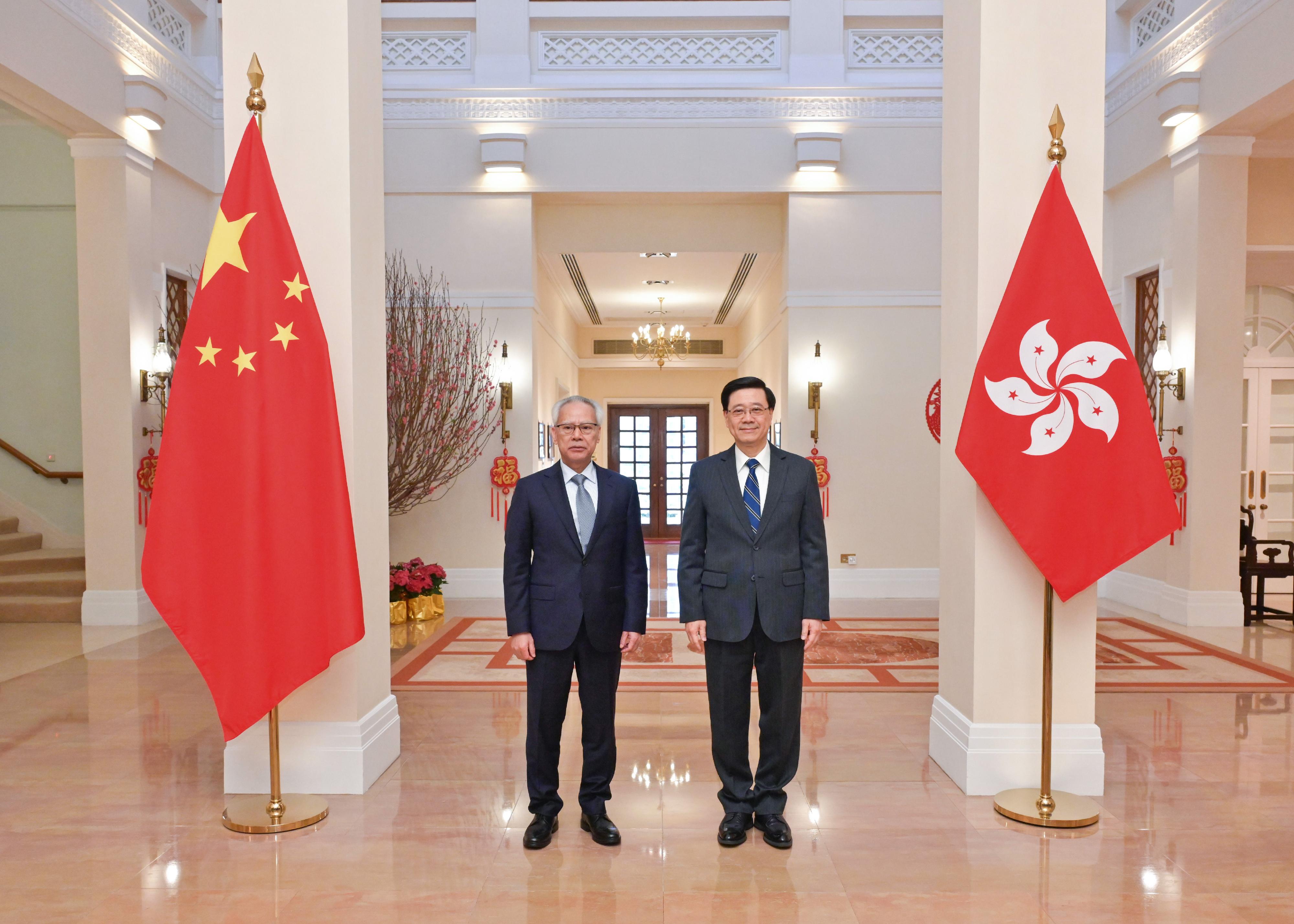 The Chief Executive, Mr John Lee (right), meets with the Chief Executive of the Macao Special Administrative Region, Mr Sam Hou-fai (left), at Government House today (February 14).