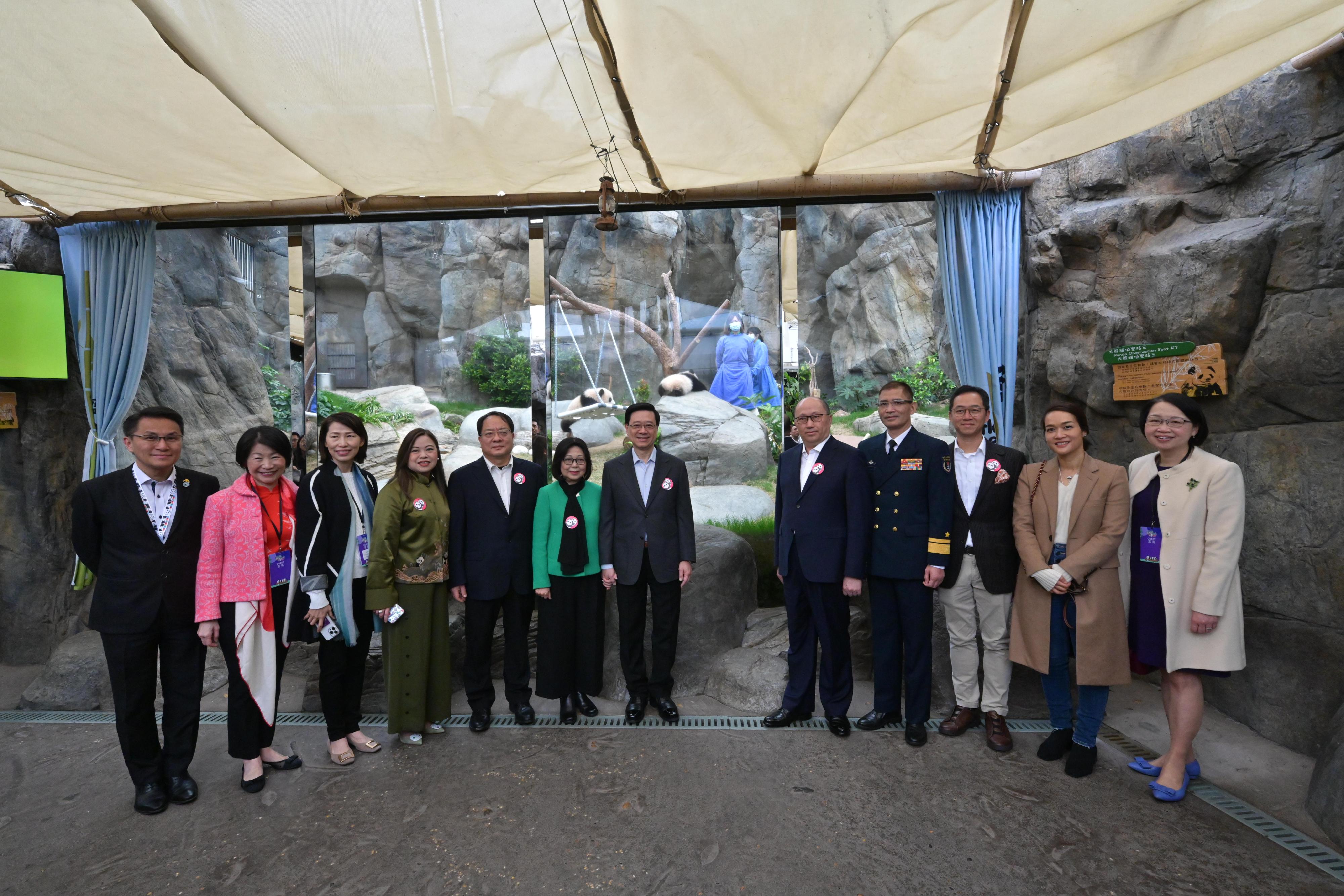 The Chief Executive, Mr John Lee, attended the Giant Panda Twin Cubs Greeting Ceremony today (February 15). Photo shows Mr Lee (seventh left) and his wife Mrs Janet Lee (sixth left); the Director of the Liaison Office of the Central People's Government in the Hong Kong Special Administrative Region (HKSAR), Mr Zheng Yanxiong (fifth right); Deputy Commissioner of the Office of the Commissioner of the Ministry of Foreign Affairs in the HKSAR Mr Pan Yundong (fifth left); Deputy Commander-in-chief of the Chinese People's Liberation Army Hong Kong Garrison Mr Tan Zhiwei (fourth right); the Secretary for Culture, Sports and Tourism, Miss Rosanna Law (fourth left); and the Chairman of the Board of the Ocean Park Corporation, Mr Paulo Pong (third right), with the giant panda twin cubs.
