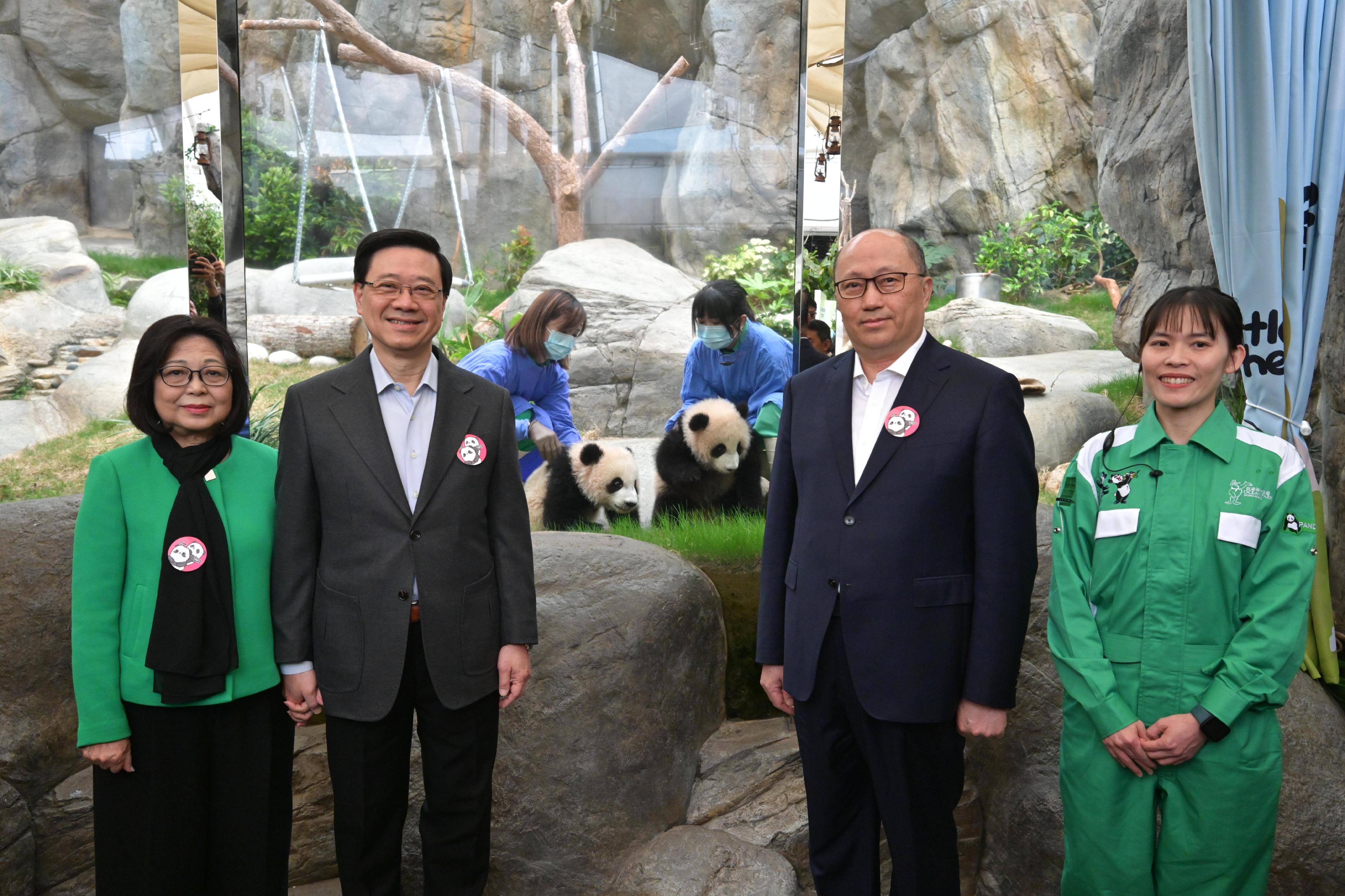 The Chief Executive, Mr John Lee, attended the Giant Panda Twin Cubs Greeting Ceremony today (February 15). Photo shows Mr Lee (second left) and his wife Mrs Janet Lee (first left); and the Director of the Liaison Office of the Central People's Government in the Hong Kong Special Administrative Region, Mr Zheng Yanxiong (second right), with the giant panda twin cubs.