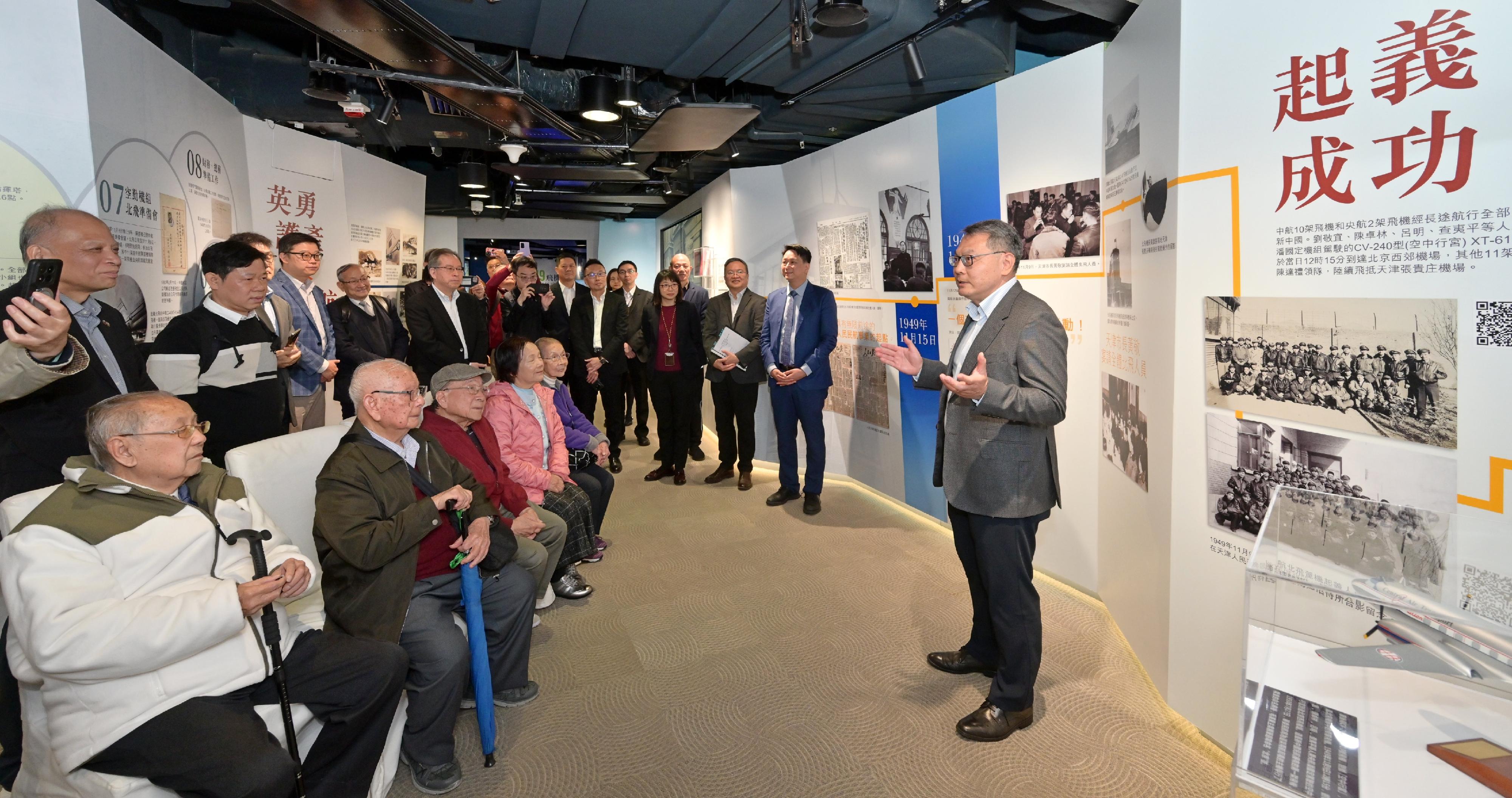 The exhibition galleries on the "Uprising of the Two Airlines" and the civil aviation development of China at the Aviation Education Path, which has been newly set up by the Civil Aviation Department, are open to the public starting from today (February 19). Photo shows the Director-General of Civil Aviation, Mr Victor Liu (first right), introducing themed exhibits to the first group of visitors to the new exhibition galleries.