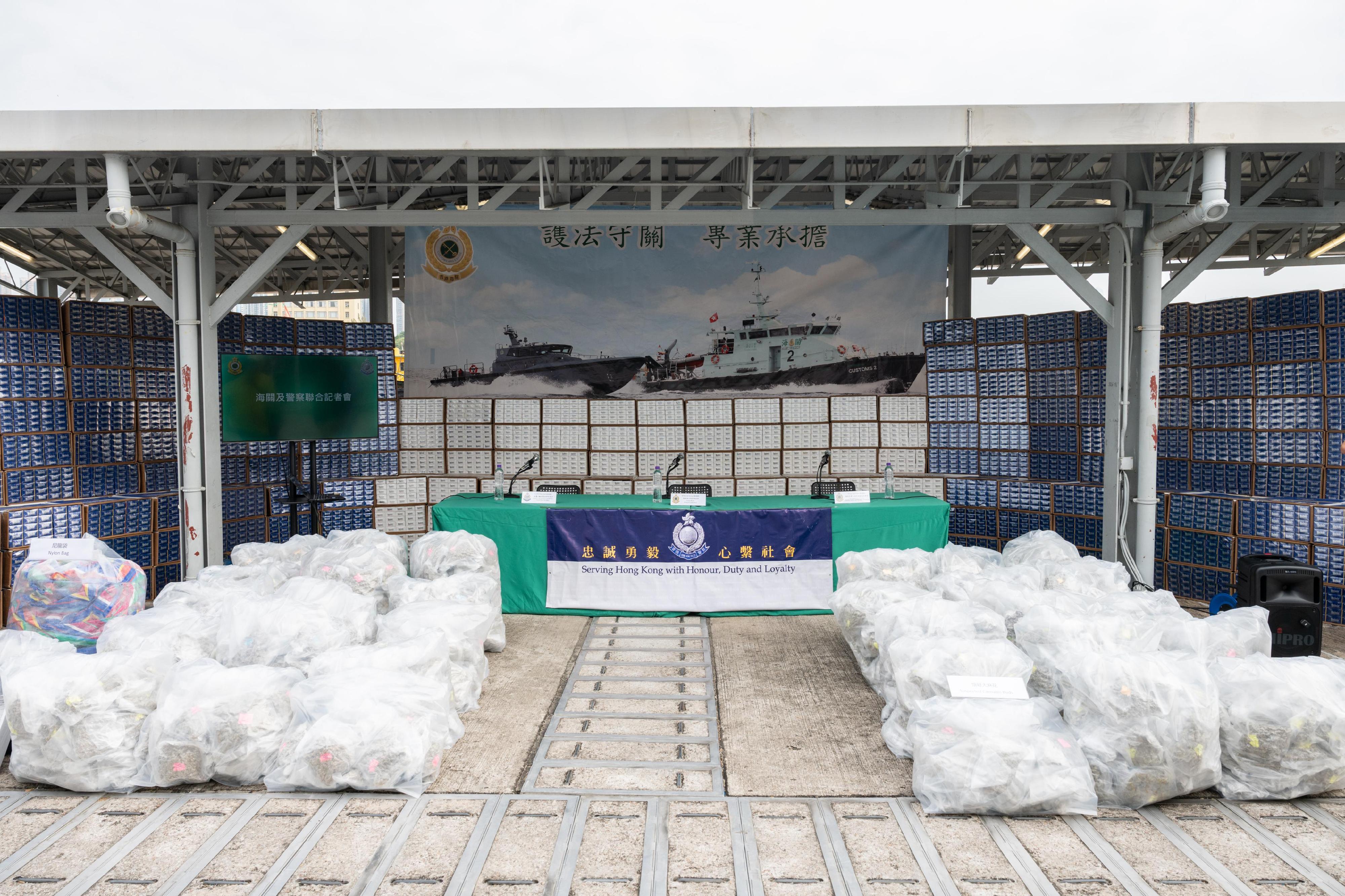 Hong Kong Customs and the Marine Police conducted joint operations from February 12 to 19 targeting large-scale maritime smuggling activities and six cases involving suspected illicit cigarettes and suspected dangerous drugs were detected.   During the joint operations, a total of about 16.93 million sticks of suspected illicit cigarettes and 459 kilograms of suspected cannabis buds were seized. Photo shows the suspected illicit cigarettes and suspected cannabis buds seized.