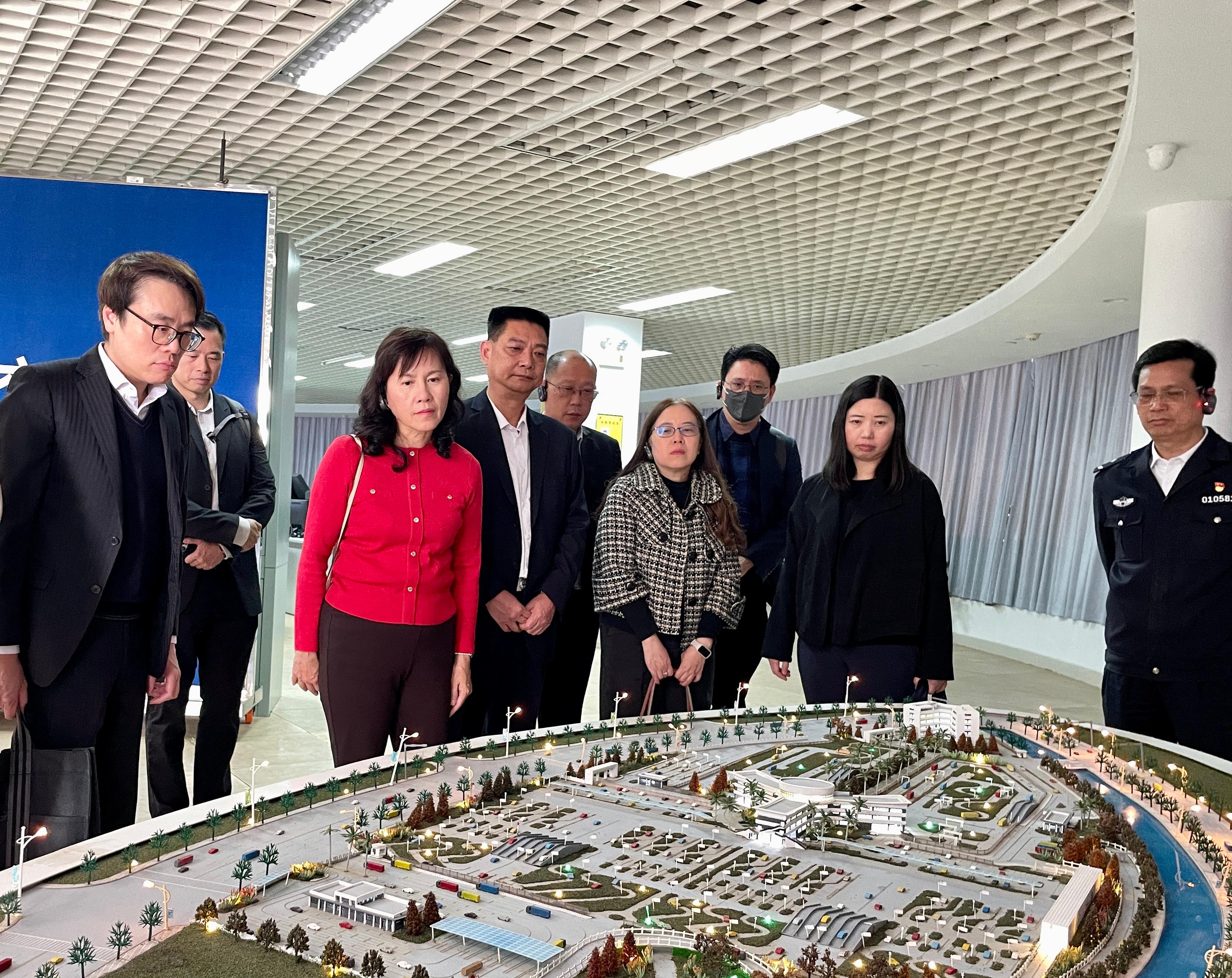 The Secretary for Transport and Logistics, Ms Mable Chan, visited Guangzhou today (February 20). Photo shows Ms Chan (front row, second left) visiting a local transportation facility to learn about its operation.