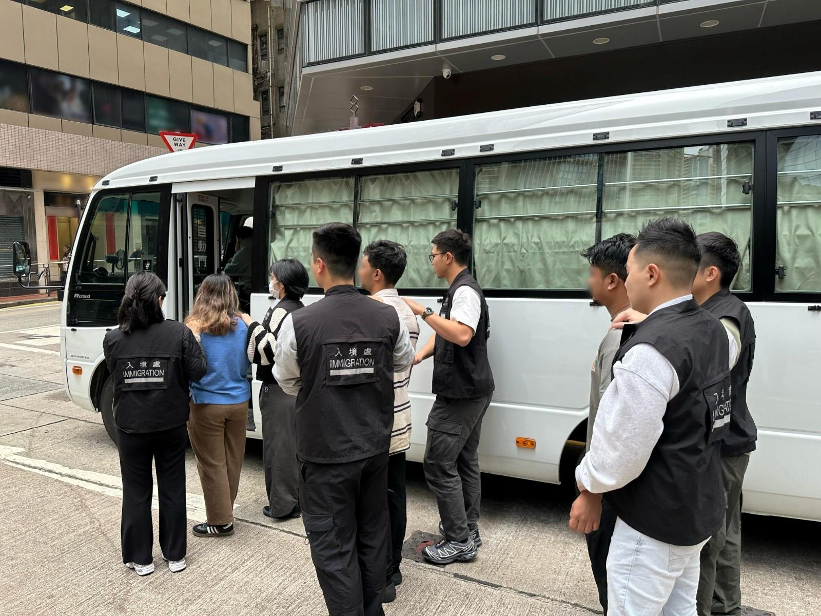 The Immigration Department mounted a series of territory-wide anti-illegal worker operations codenamed "Twilight", and a joint operation with the Hong Kong Police Force codenamed "Windsand", for three consecutive days from February 18 to yesterday (February 20). Photo shows suspected illegal workers arrested during an operation.