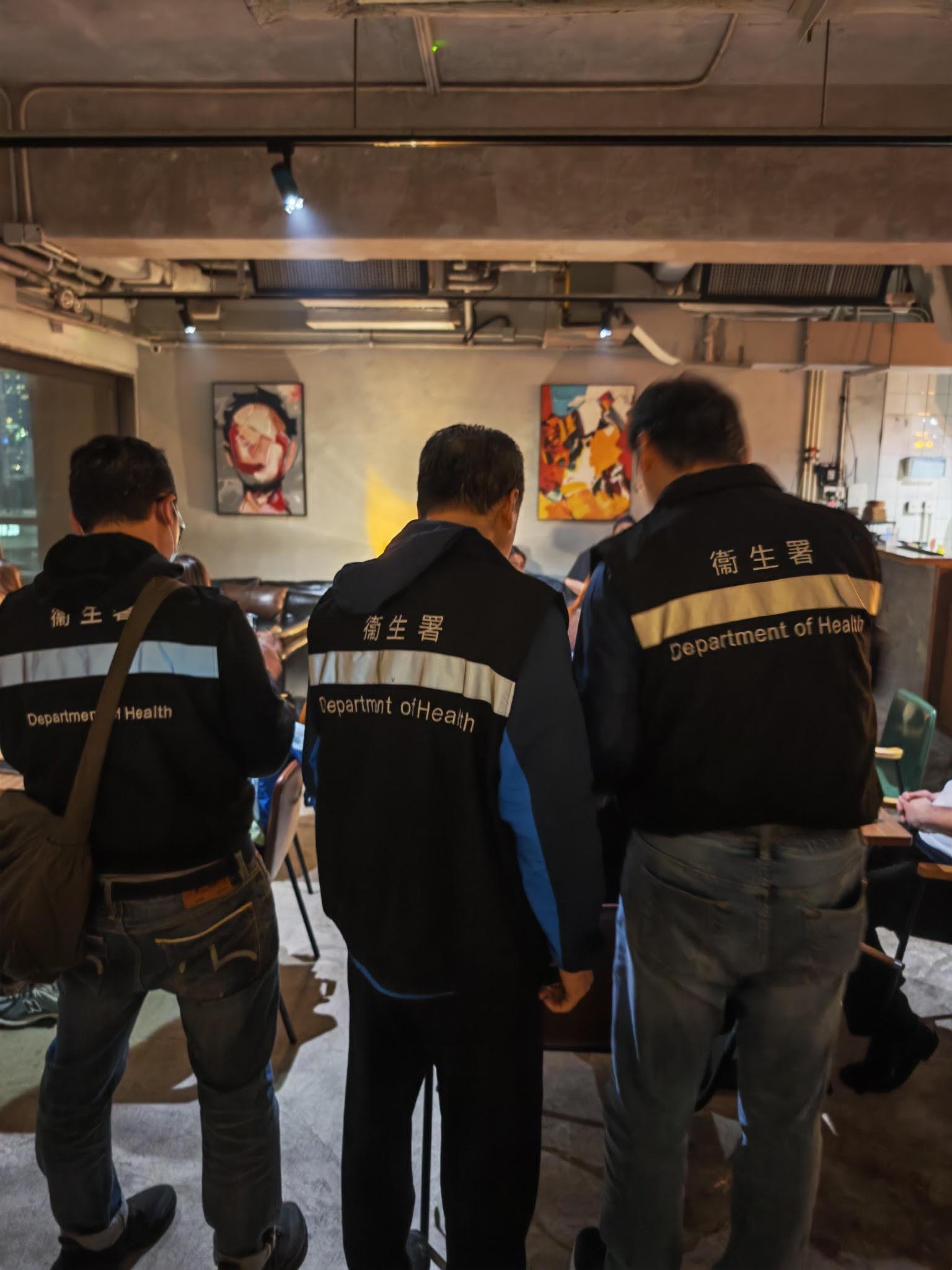 The Tobacco and Alcohol Control Office (TACO) of the Department of Health conducted an enforcement operation in Tsim Sha Tsui last night (February 21) against illegal waterpipe smoking activities in no smoking areas and a total of three fixed penalty notices were issued. Photo shows TACO officers taking enforcement action inside a bar.