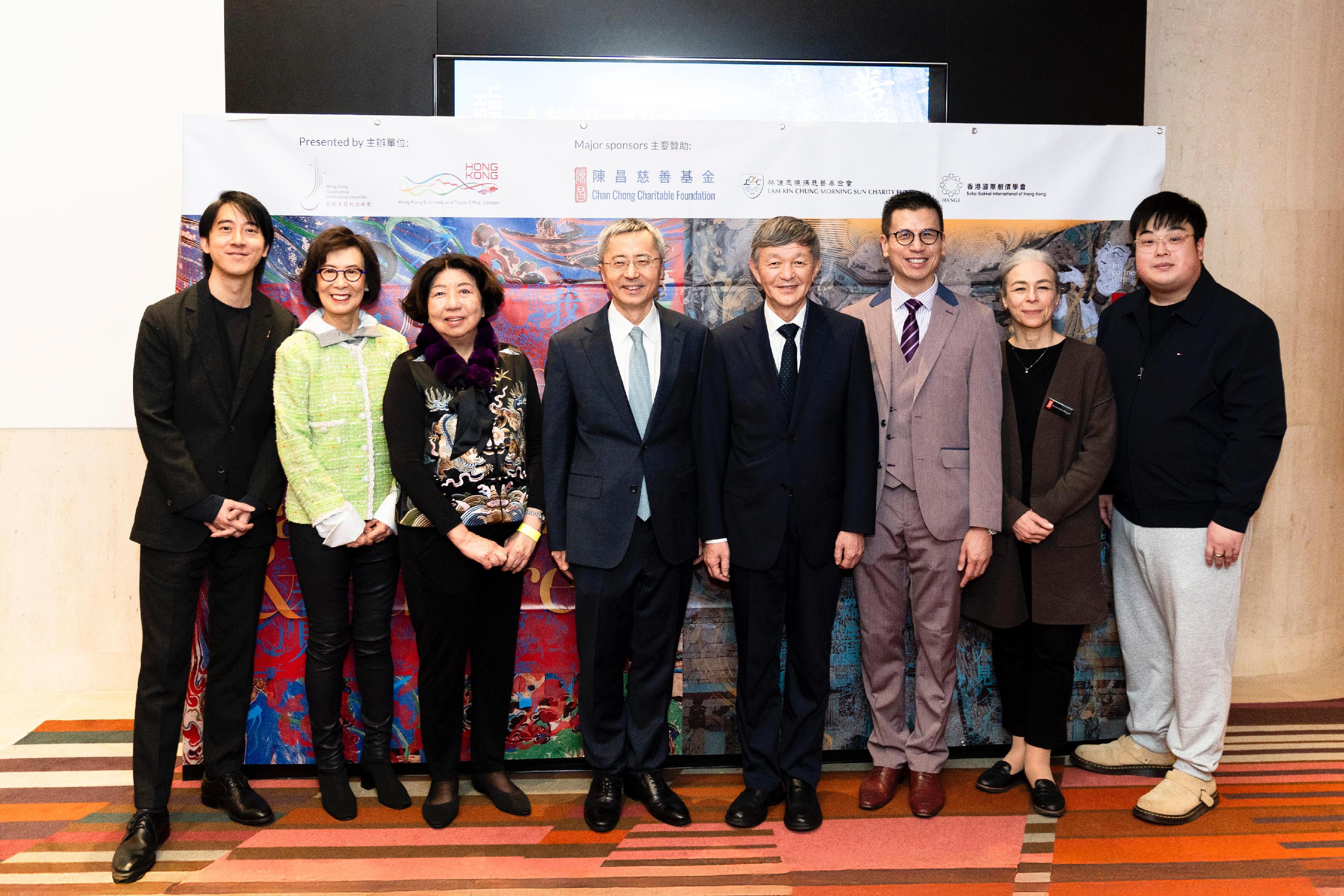 The Hong Kong Economic and Trade Office, London (London ETO) supported the Hong Kong Gaudeamus Dunhuang Ensemble's concert, titled "Resonance of the Silk Road: Past, Present & Future Concert", at the British Library in London, the United Kingdom (UK), on February 21 (London time). Photo shows (from left) the Artistic Director of the ensemble, Mr Kam Shing Hei; the Chairman of Chan Chong Charitable Foundation, Mrs Pansy Muller; the founder of the ensemble, Ms Leonie Ki; Minister of the Embassy of the People's Republic of China in the UK, Mr Wang Qi; the Director of the Dunhuang Academy, Mr Su Bomin; the Director-General of the London ETO, Mr Gilford Law; the Head of the Asian and African Collections Department of the British Library, Dr Luisa Mengoni; and Deputy Artistic Director of the ensemble, Mr Chu Kai Yeung at the reception.
