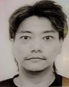Zhou Zhibin, aged 34, is about 1.7 metres tall, 70 kilograms in weight and of medium build. He has a round face with yellow complexion and short black hair. He was last seen wearing a dark green jacket, grey trousers and beige sports shoes. 