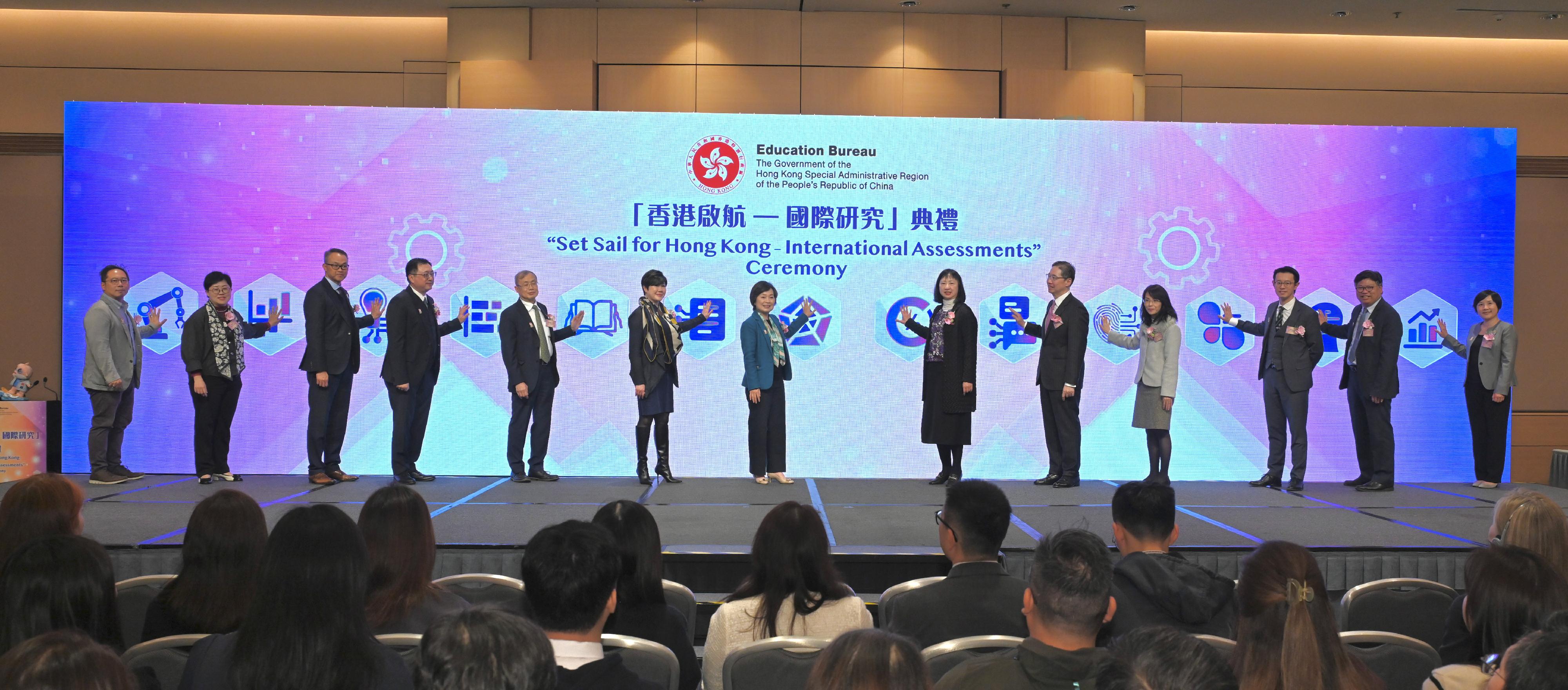 The Secretary for Education, Dr Choi Yuk-lin (centre), the Permanent Secretary for Education, Ms Michelle Li (sixth right), and other guests officiate at the "Set Sail for Hong Kong - International Assessments" Ceremony today (February 27).

